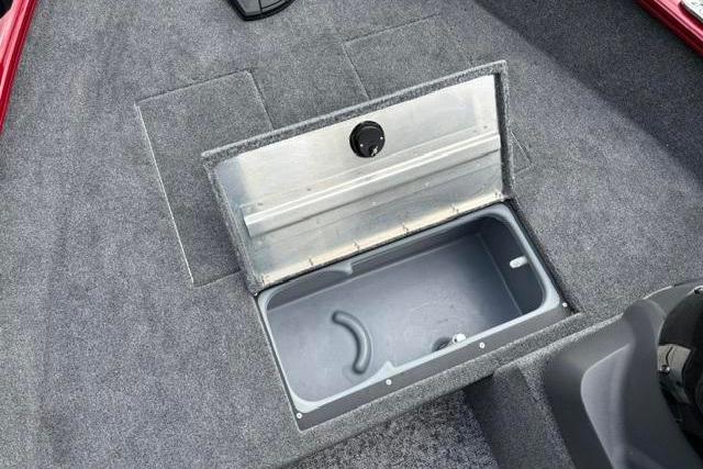 2025 Tracker Super Guide V-16 SC boat storage compartment with open lid, showcasing interior space.