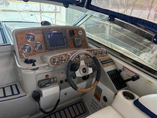 The cockpit of a 2007 Formula 34 Performance Cruiser with modern instruments and a steering wheel.