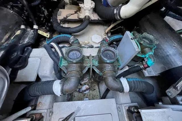 Engine compartment of a 2016 Sea Ray Sundancer 510 with visible hoses and components.