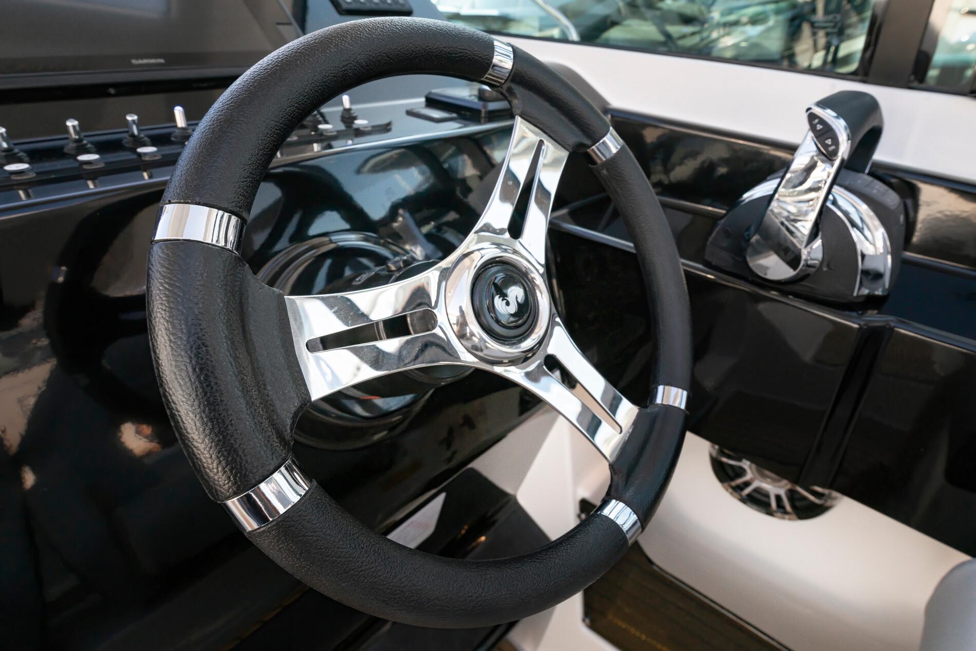 Steering wheel and controls of 2025 Beneteau 32 Gran Turismo yacht.