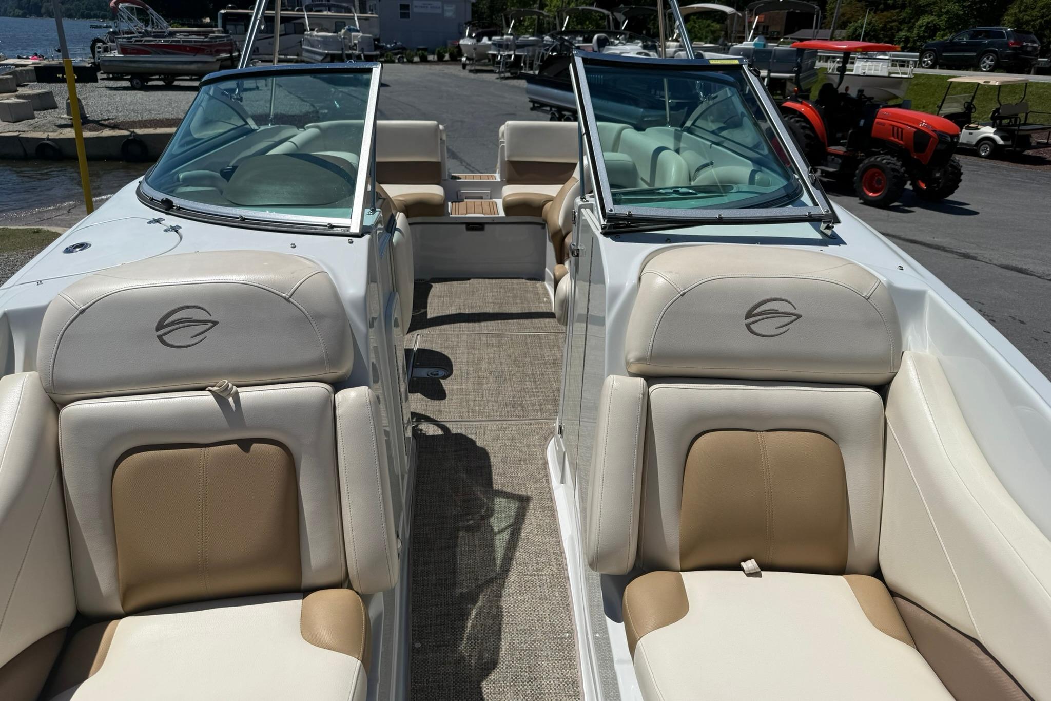 2016 Crownline 255 SS boat interior with beige seating and open cockpit design.