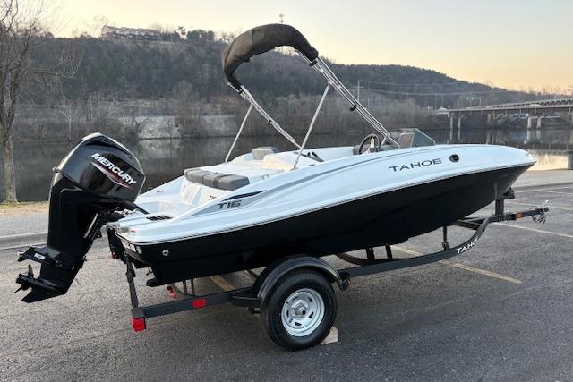 2026 Tahoe T16 boat on trailer by a scenic riverside.