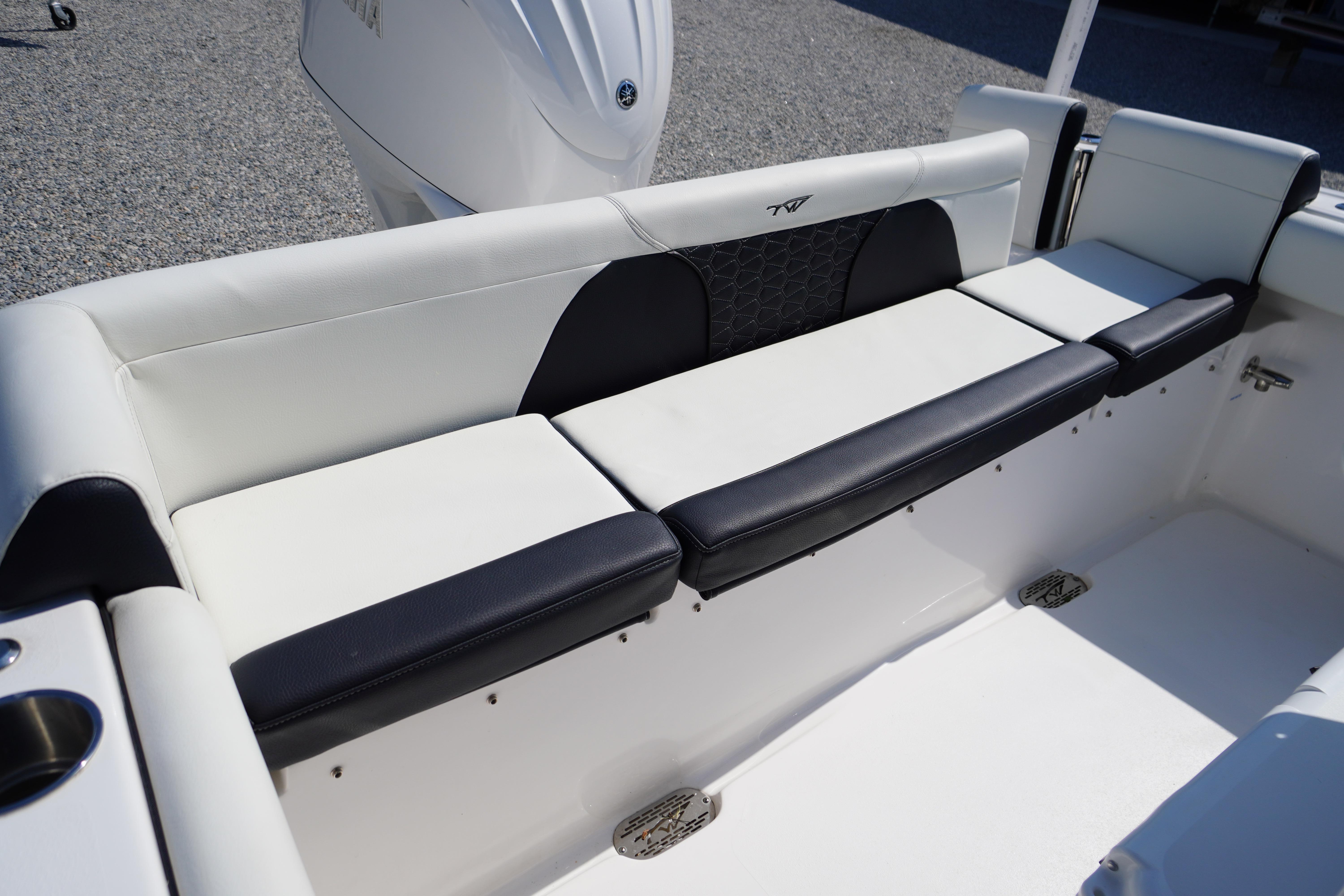 2025 Tidewater 232 SS boat seating with sleek black and white upholstery.