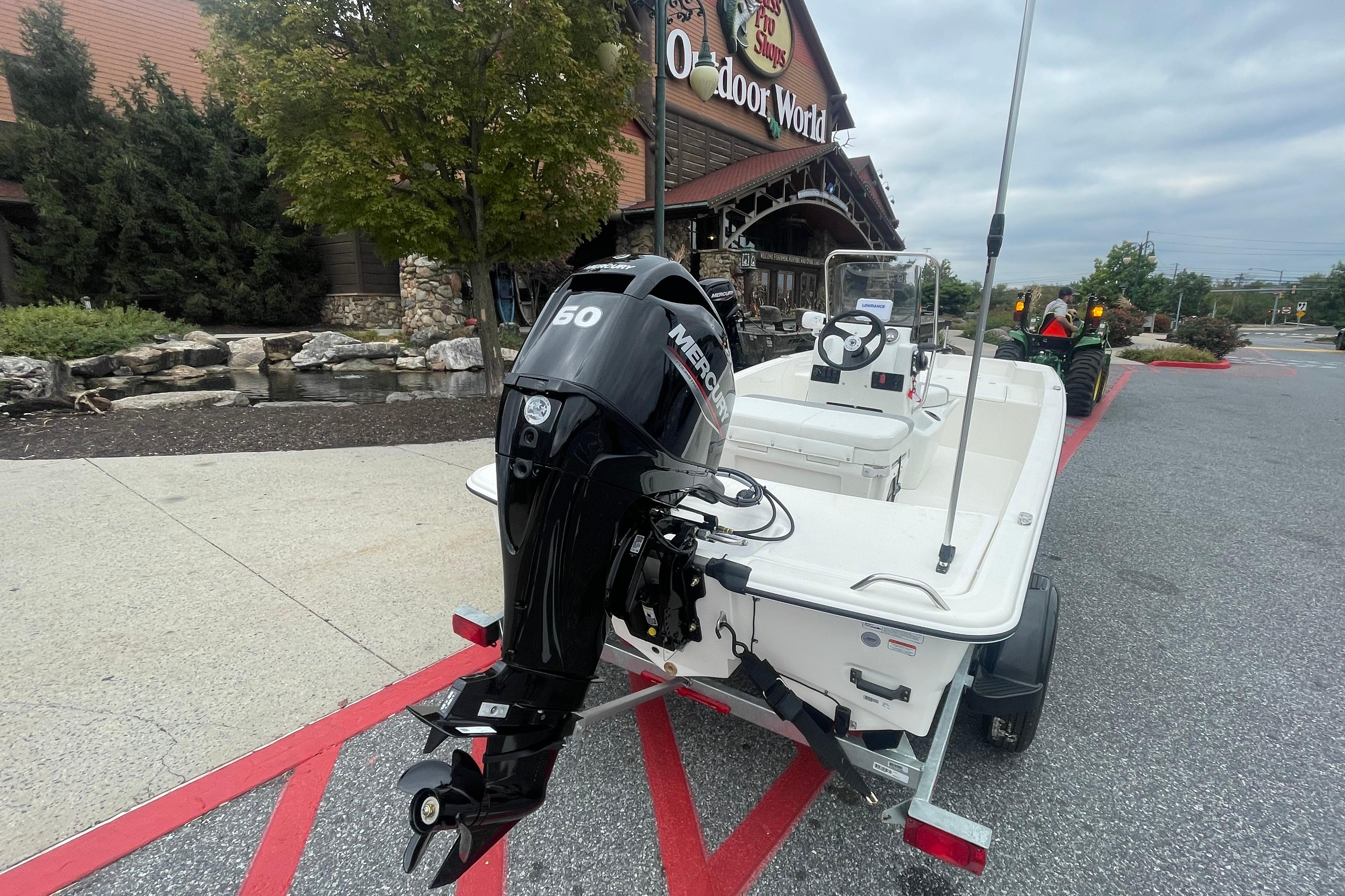 2026 Mako Pro Skiff 15 CC with Mercury engine outside Bass Pro Shops.