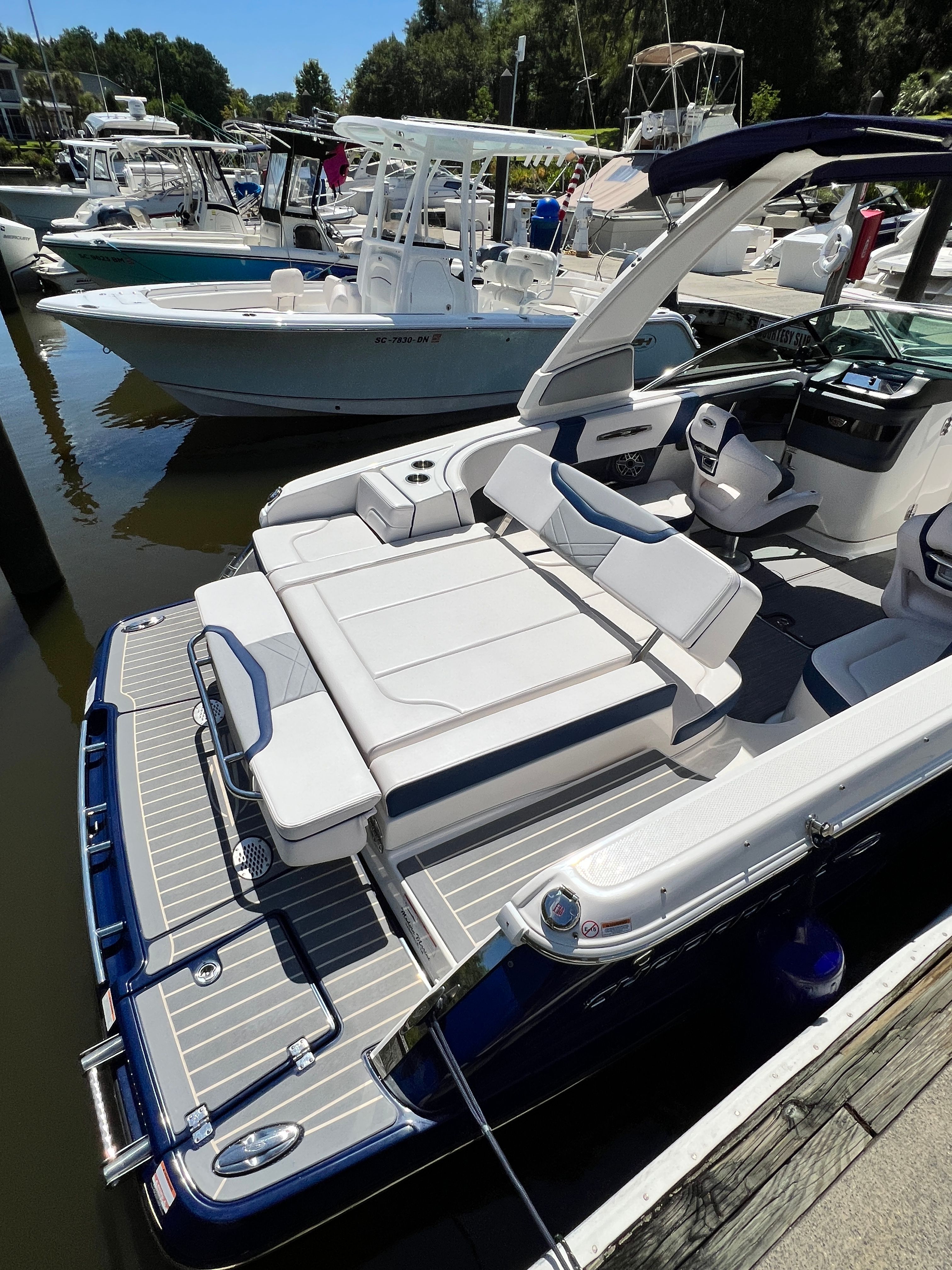 2020 Chaparral 256 SSX motorboat docked, featuring luxurious design.