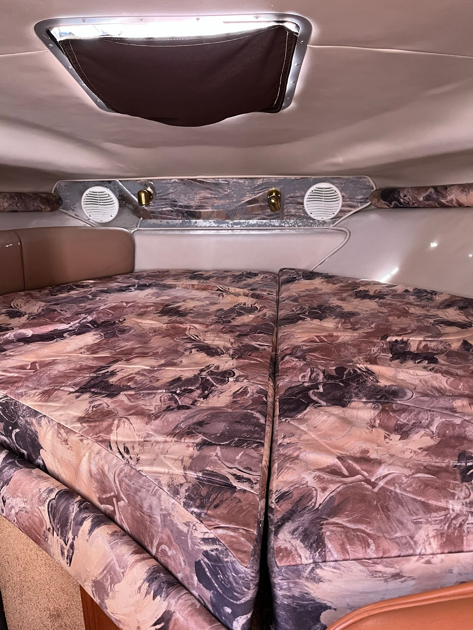 Interior of a 2000 Chaparral Signature with patterned upholstery.