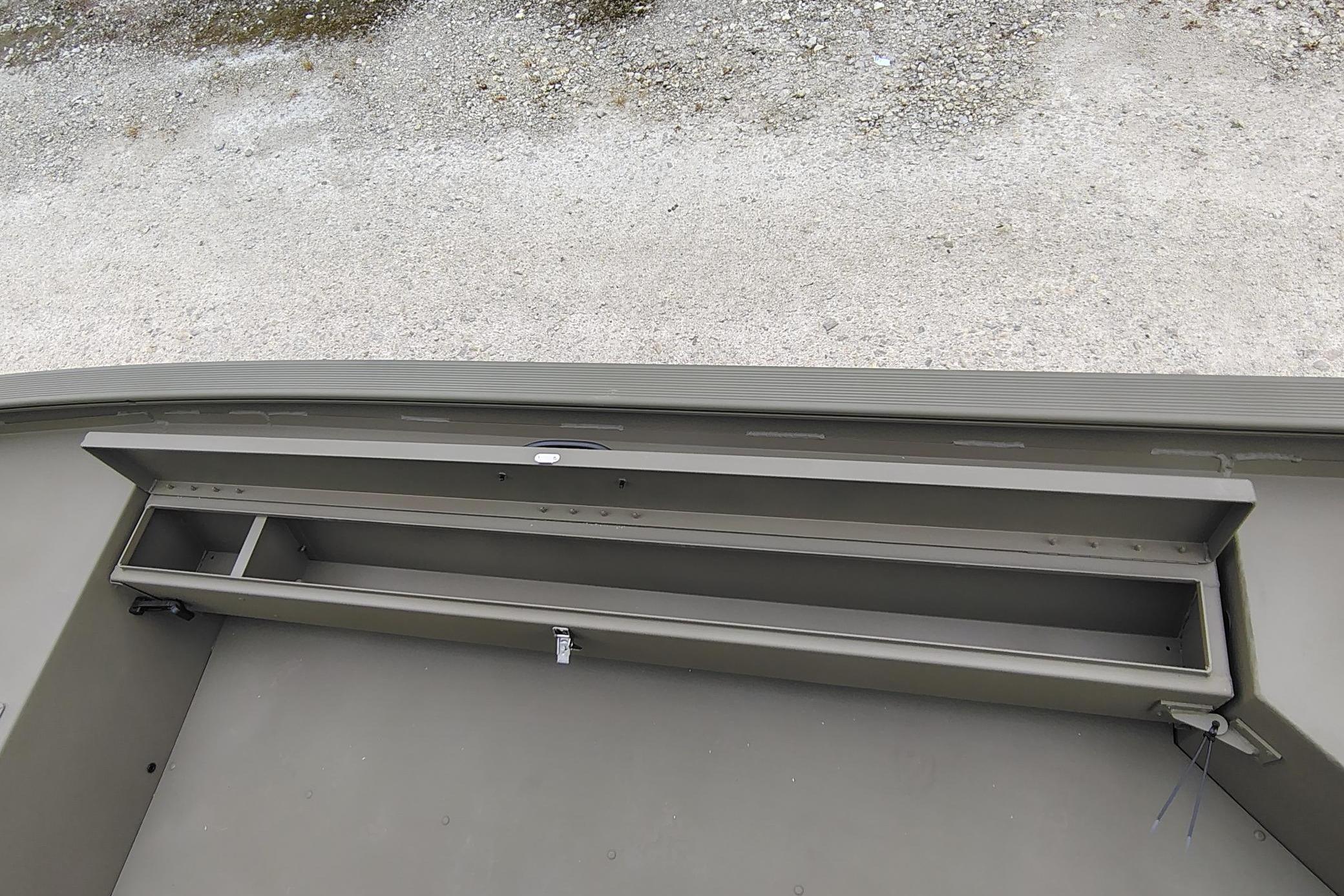 Storage compartment of 2026 Tracker Grizzly 1654 T Sportsman boat, featuring durable construction.