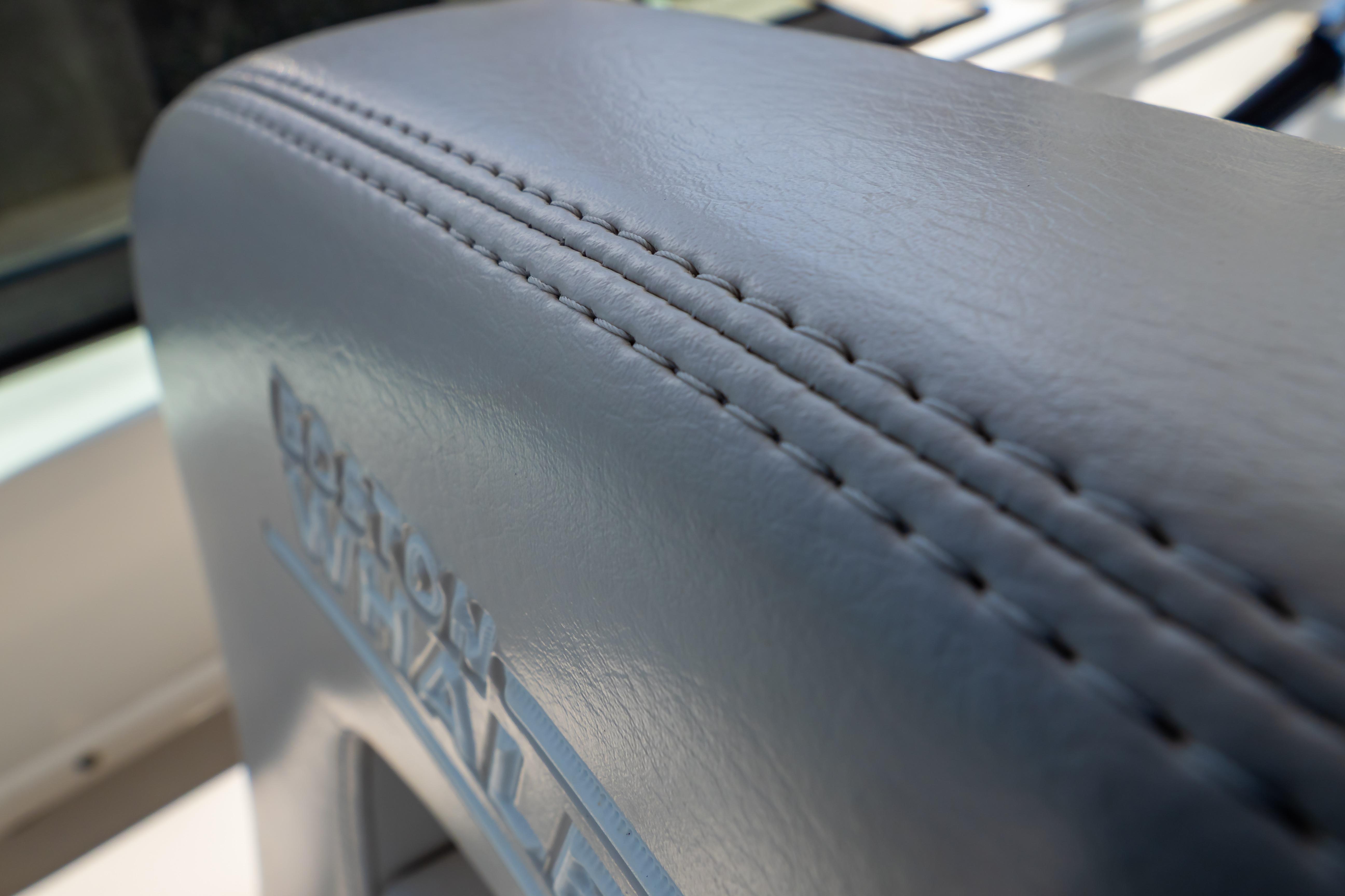 Close-up of 2019 Boston Whaler 270 Vantage seat stitching detail.