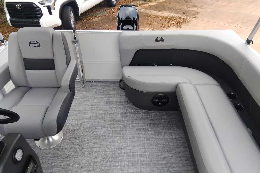 2026 Sun Tracker Party Barge 16 DLX interior with gray seating and modern design.