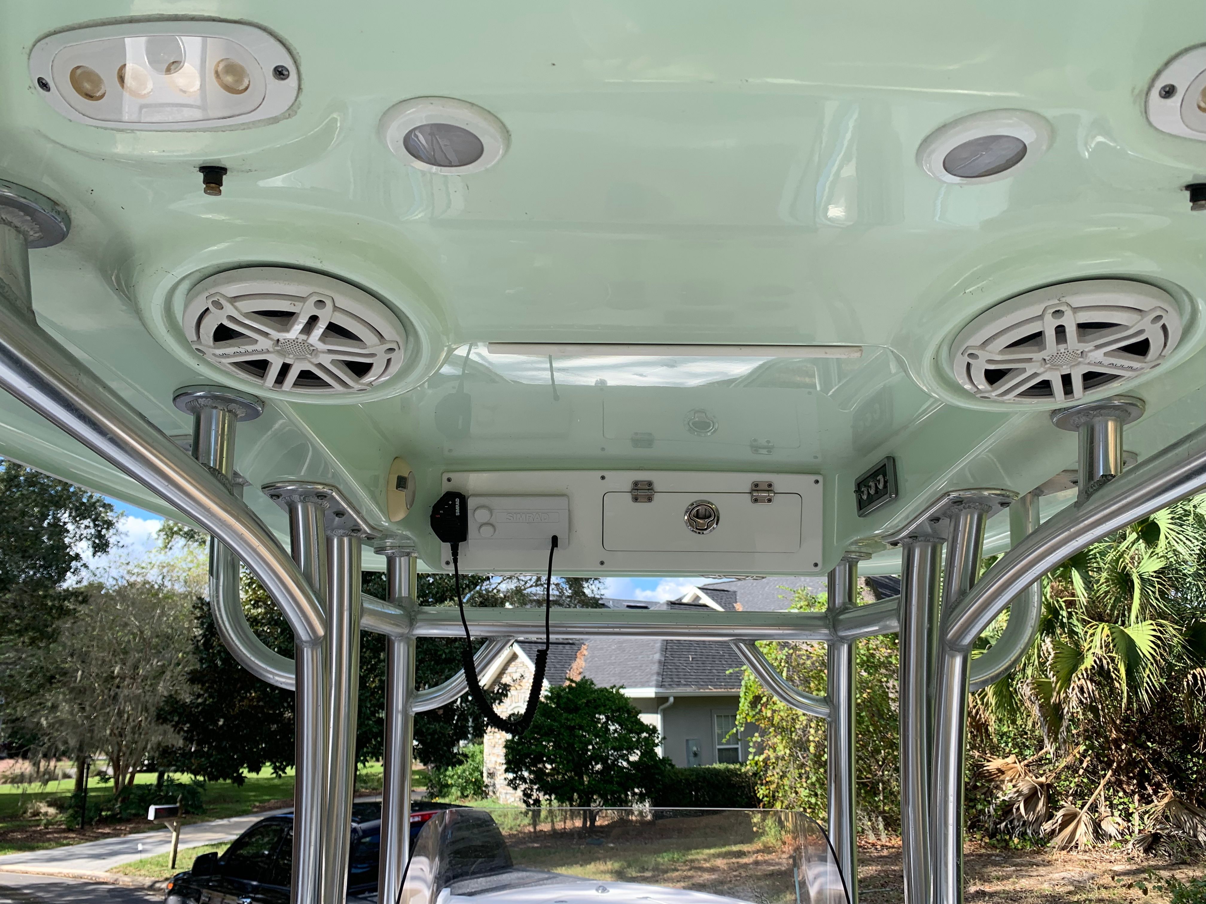 The image shows the roof of a Sportsman Heritage 241 Center Console boat with speakers and lights.