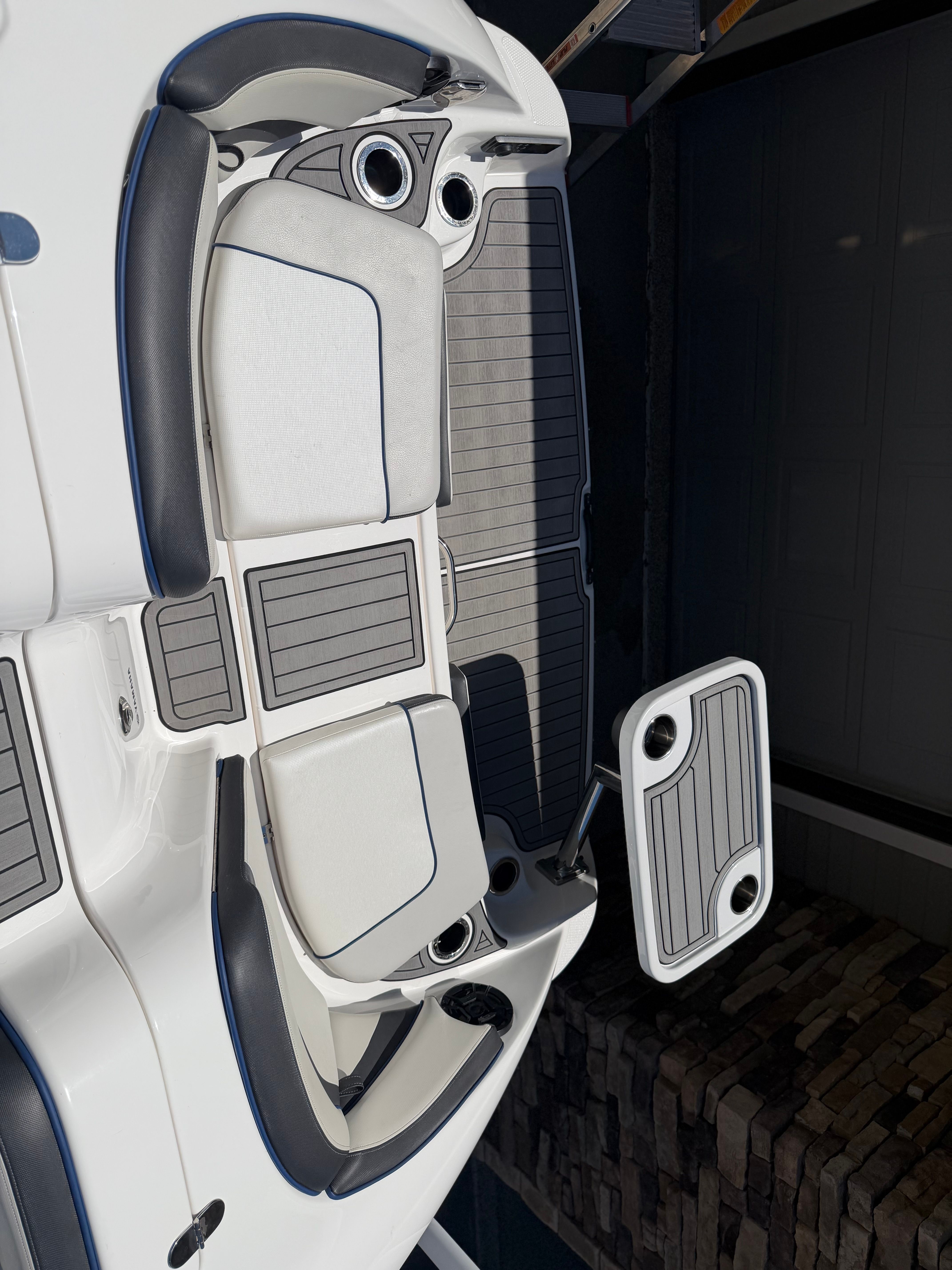 The image shows the deck of a 2018 Yamaha 242 Limited S boat with gray and white upholstery.
