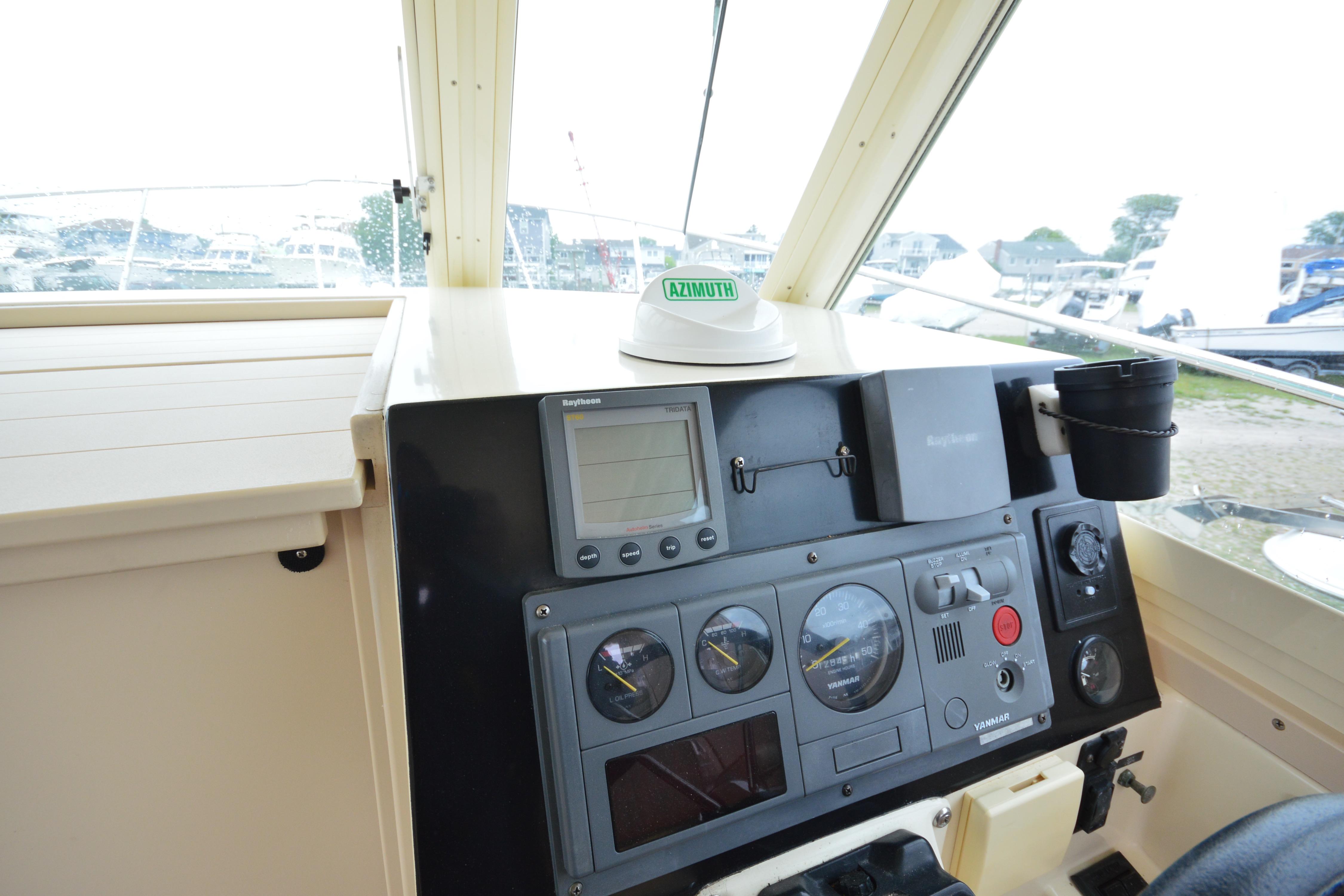 2001 Albin 28 Tournament Express helm with navigation instruments and controls.