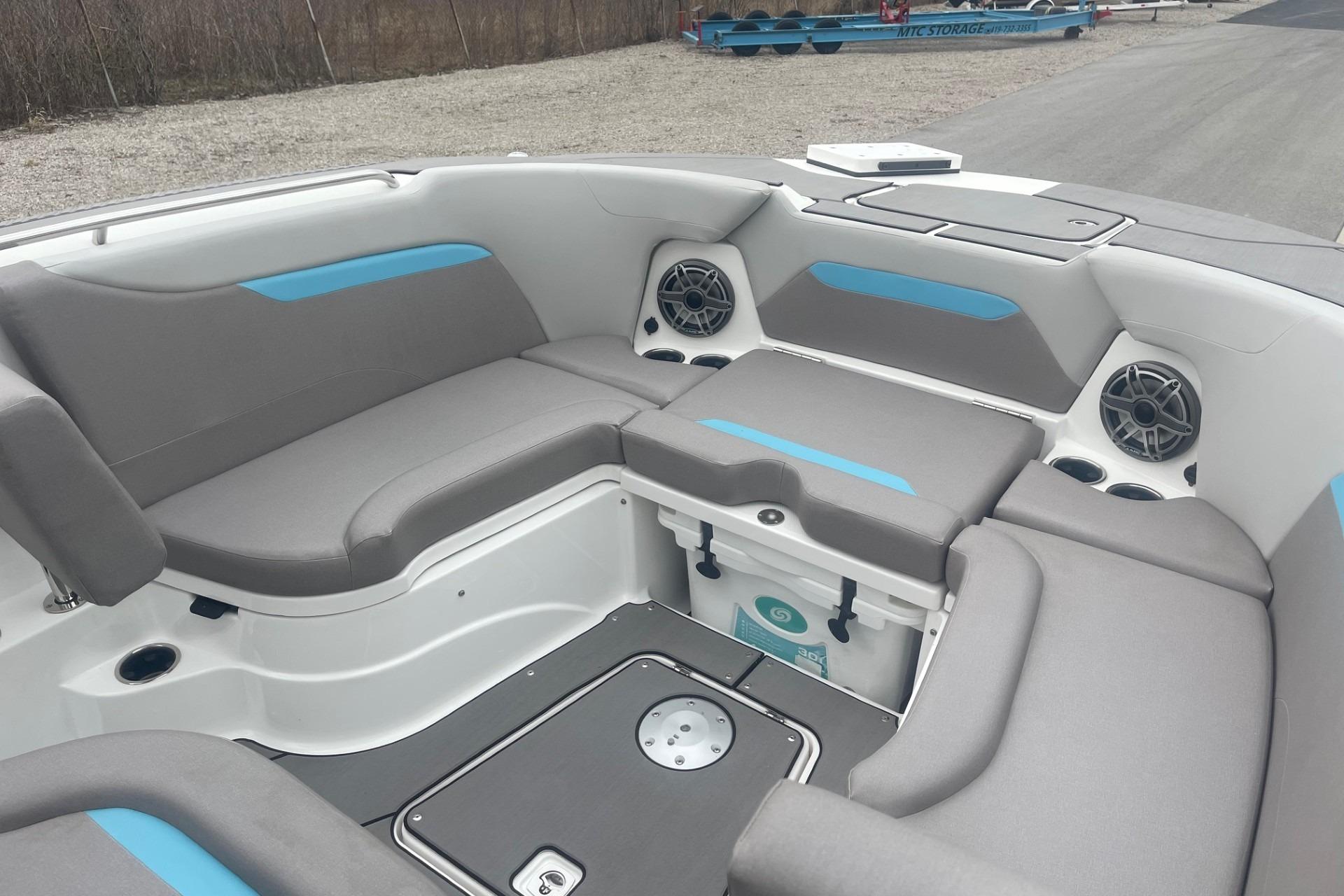 2025 Hurricane Center Console 24 OB boat interior with gray seating and blue accents.