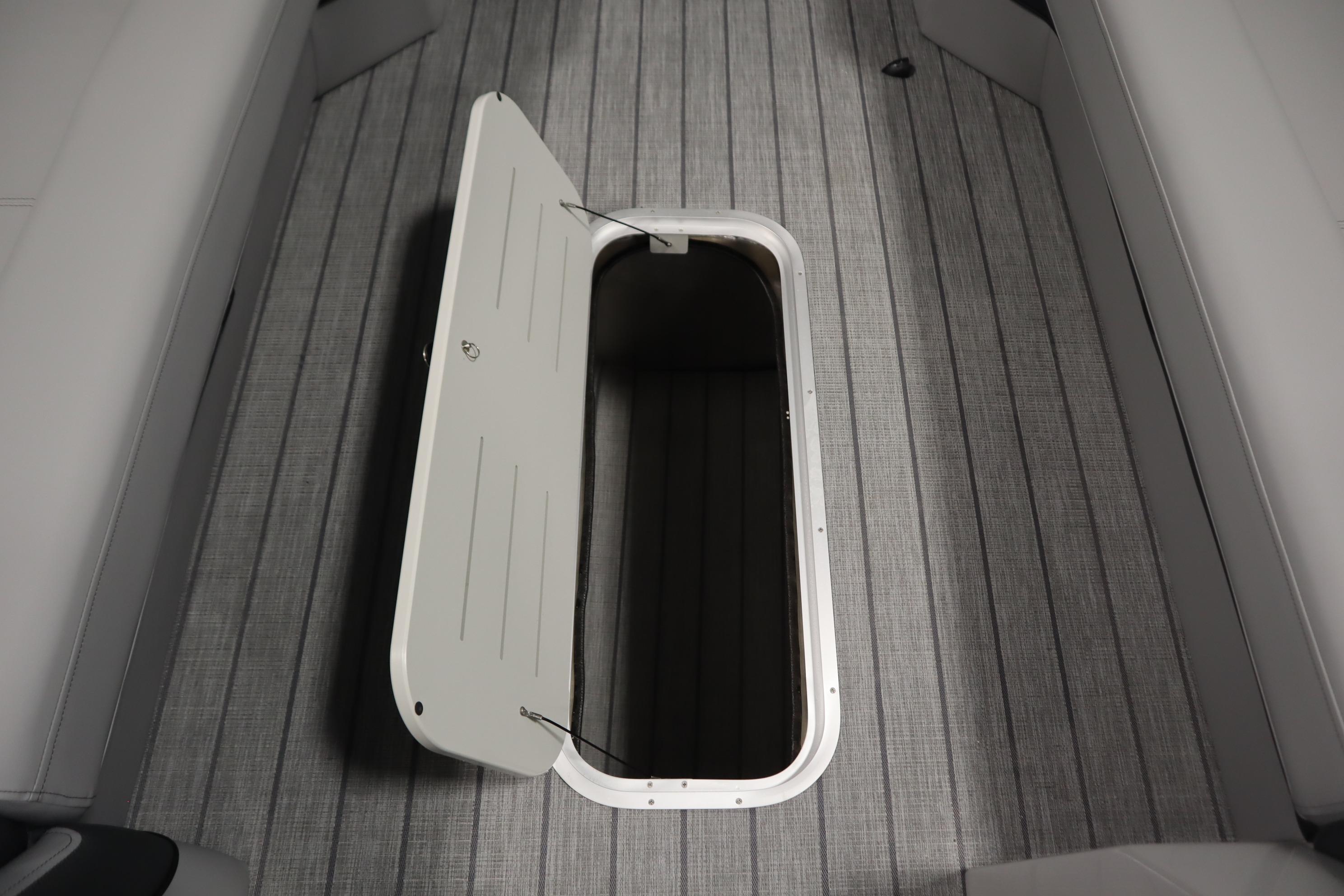 2025 Bentley Pontoons Elite 253 Admiral Tri-toon with open storage compartment on deck.