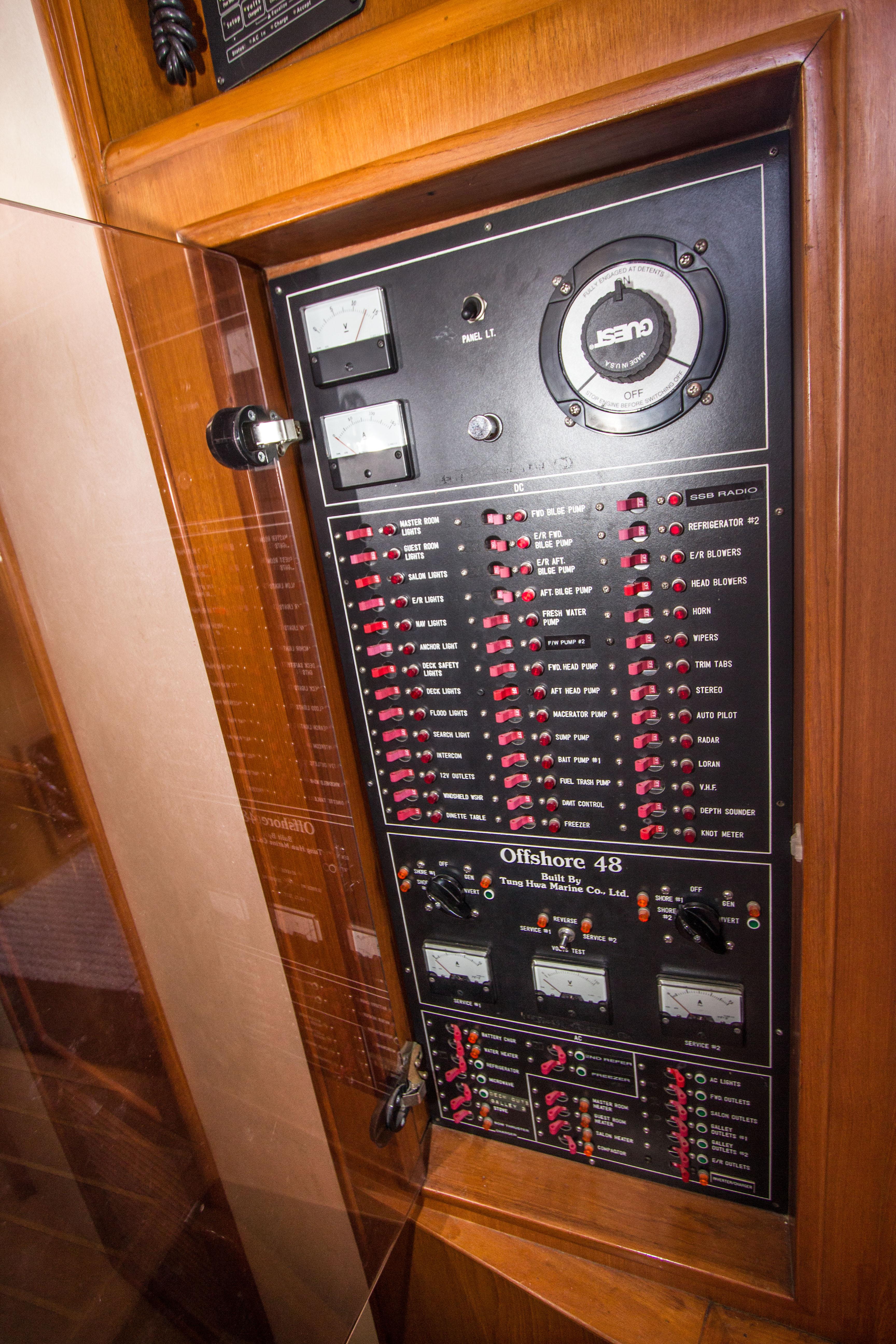 Electrical panel of a 1992 Offshore Yachts Sedan, showcasing controls and gauges.