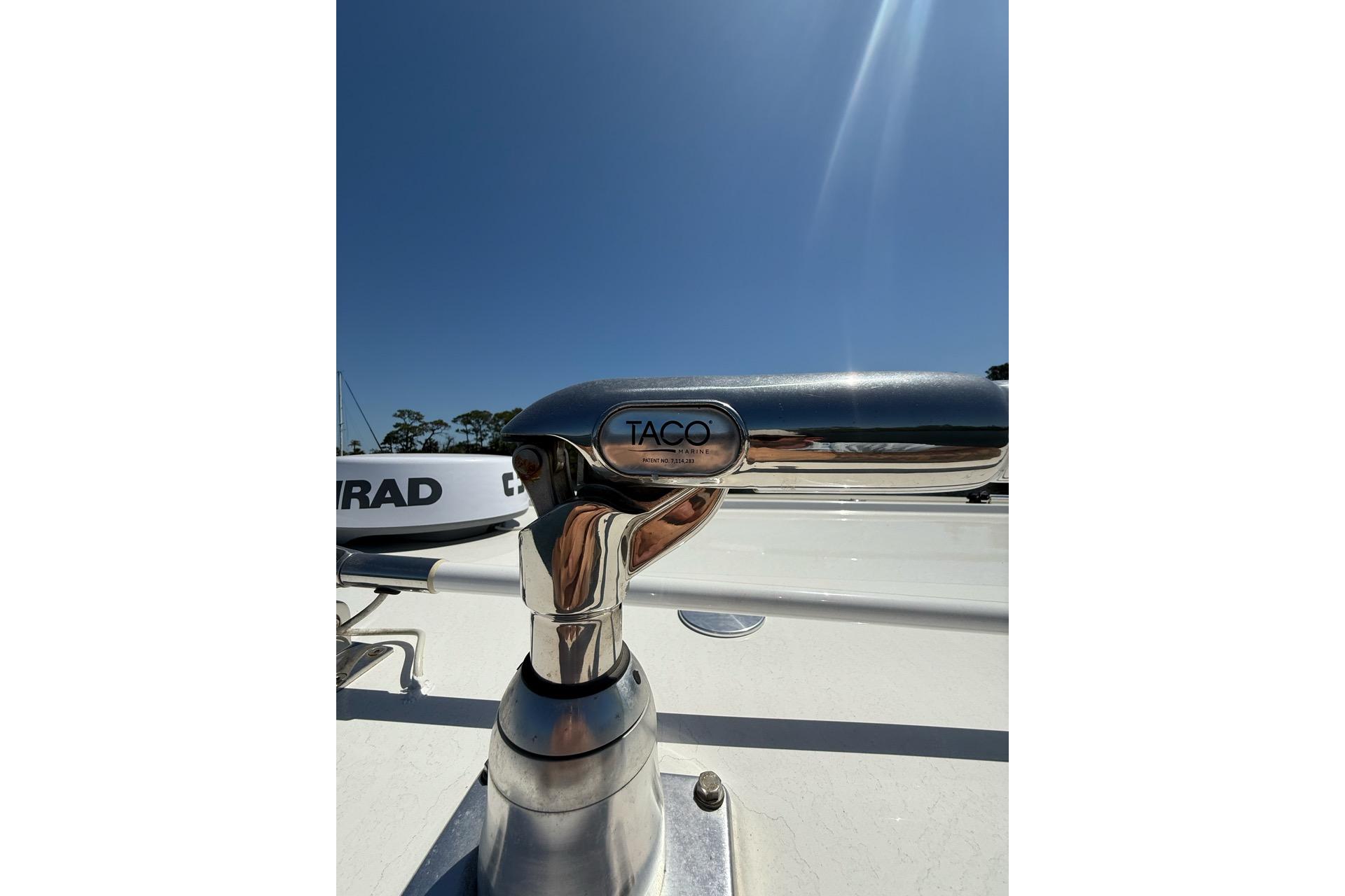 Chrome boat fitting on 2021 Custom Infusion 34 CC under clear blue sky.