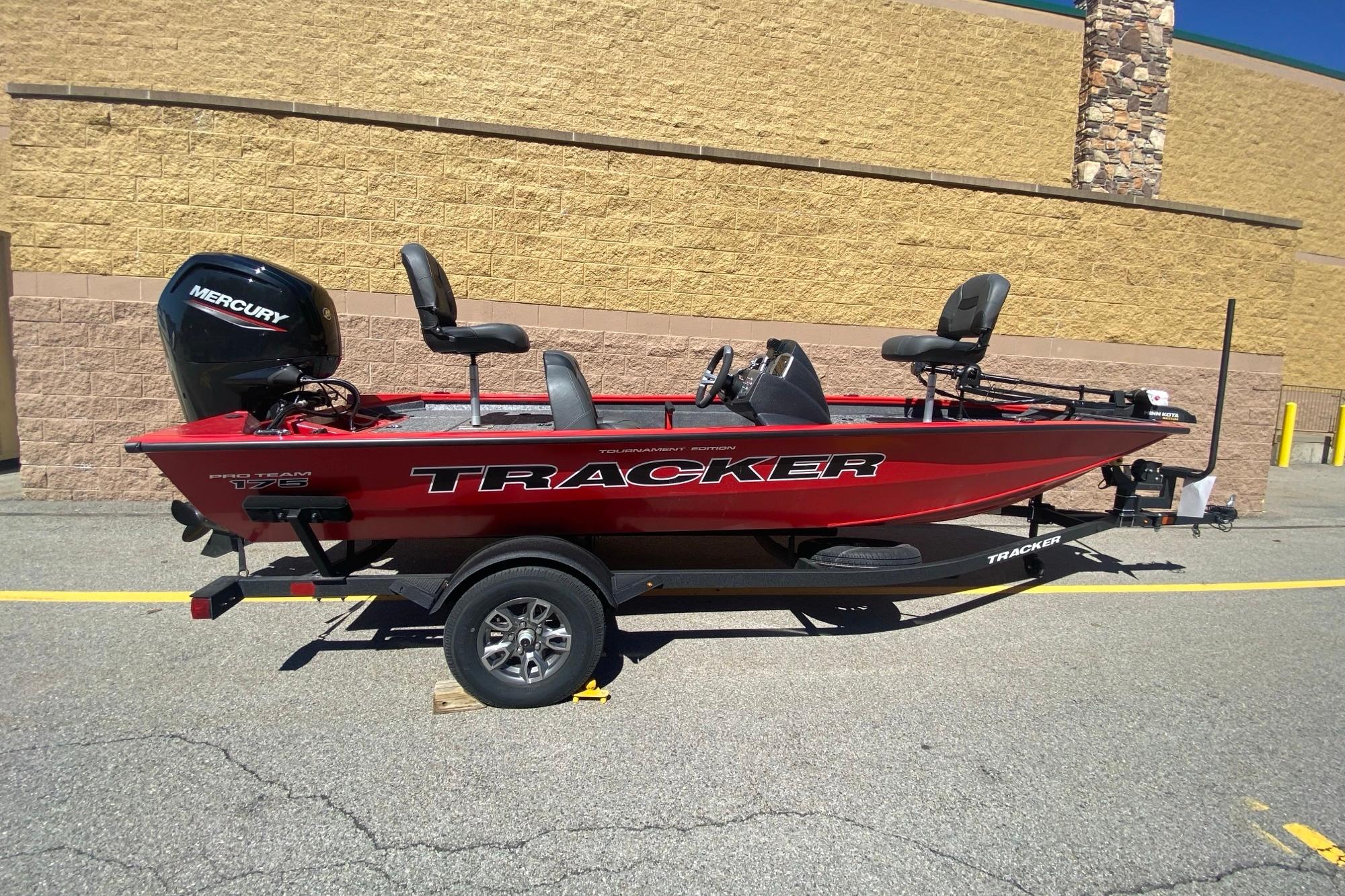 2026 Tracker Pro Team 175 boat with Mercury engine on trailer, parked outdoors.