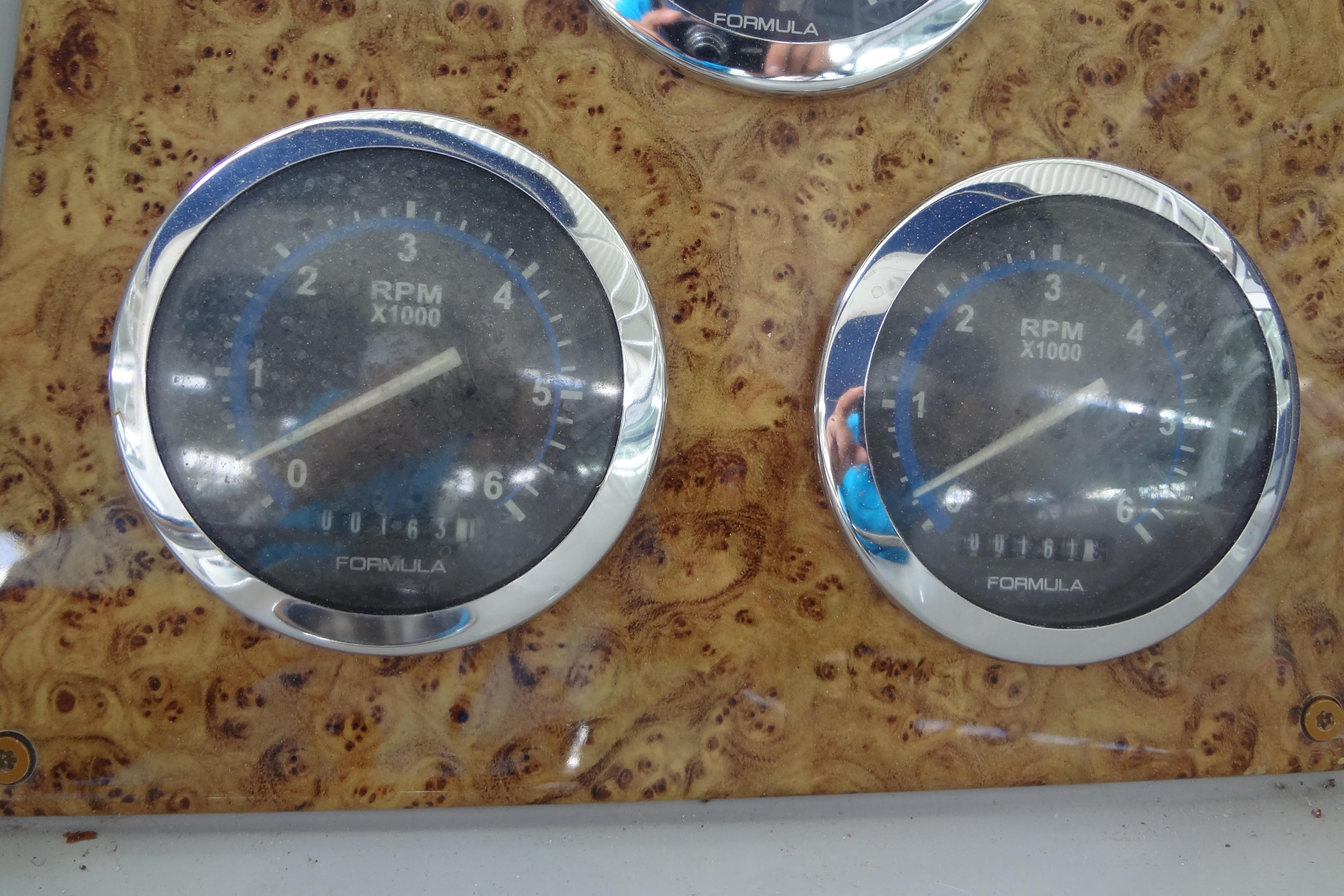 Dashboard of a 2007 Formula 34 Performance Cruiser with RPM gauges.