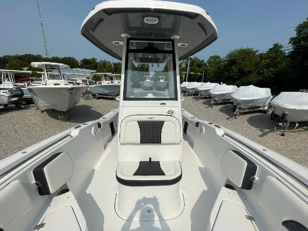 2025 Tidewater 232 CC Adventure boat, sleek design, spacious seating, outdoor showroom display.