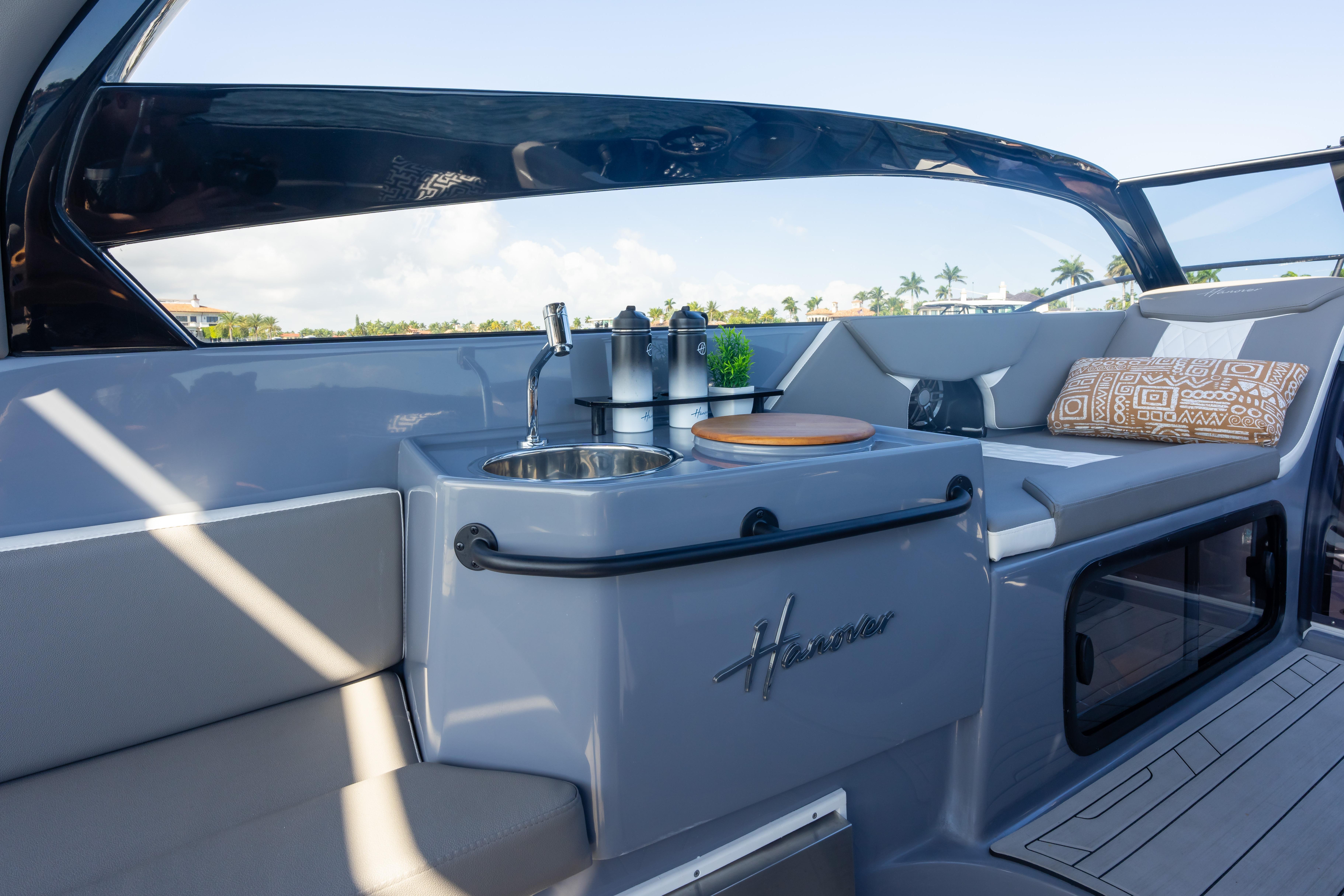 Luxurious interior of 2026 Hanover 305 yacht with sleek design and comfortable seating.