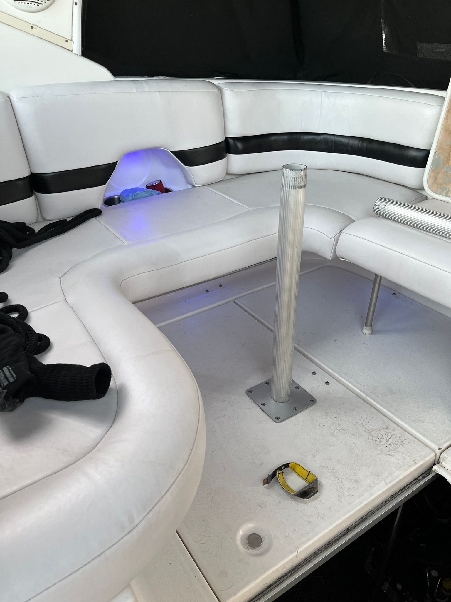 Interior of a 2000 Chaparral Signature with white seating area.