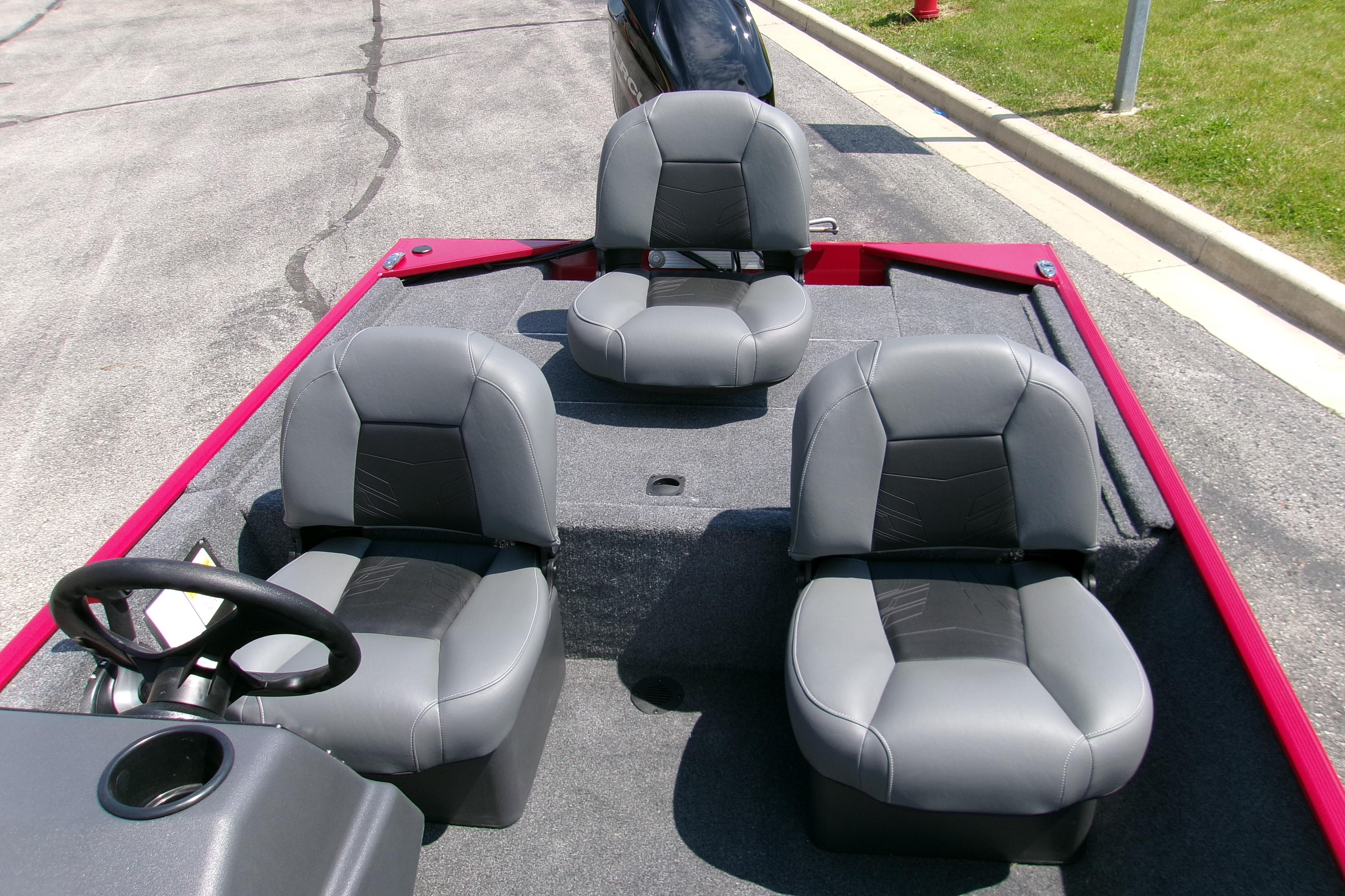2026 Tracker Bass Tracker Classic XL boat interior with three gray seats and steering wheel.