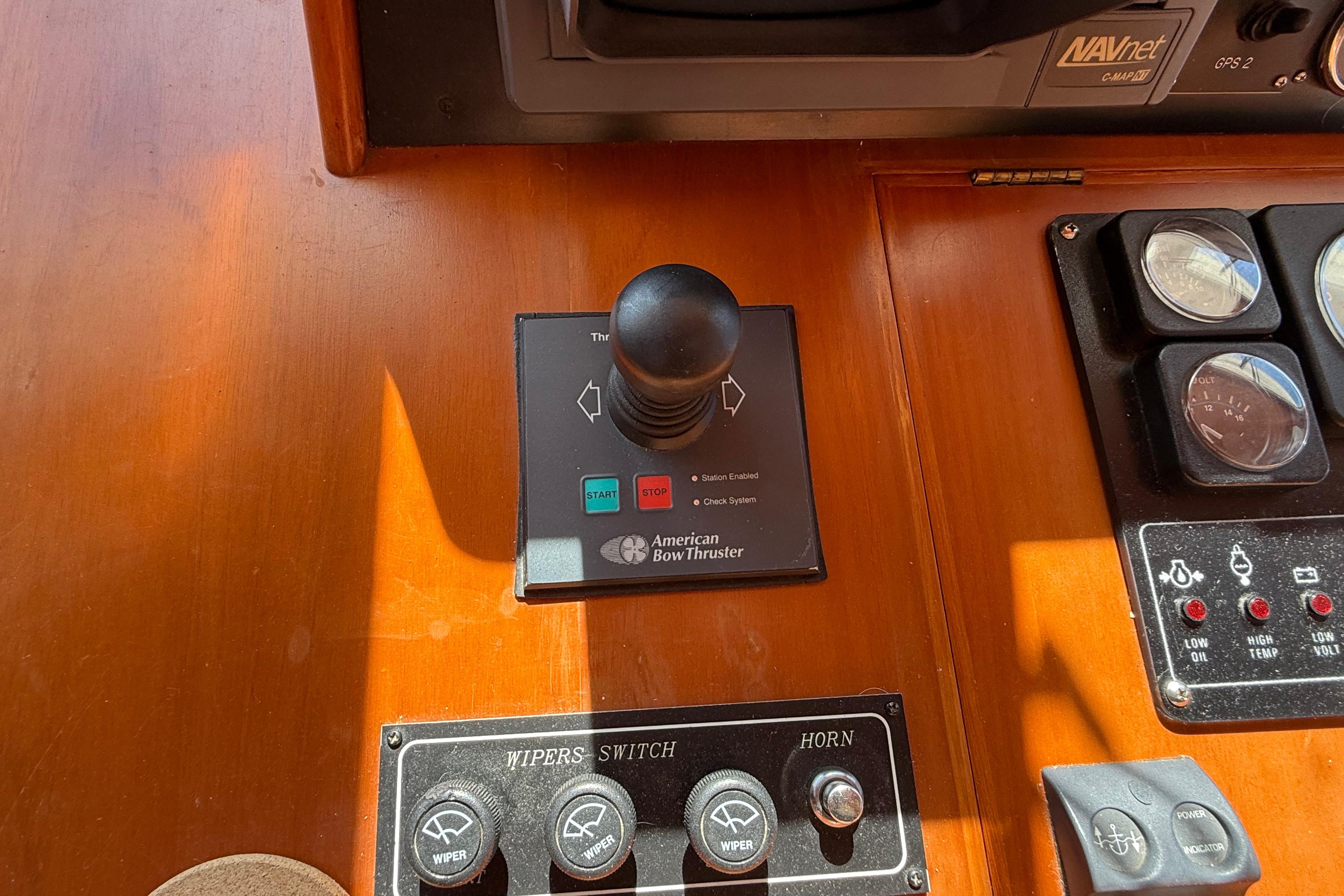Control panel of a 2001 Kadey-Krogen 39 boat with American Bow Thruster joystick.