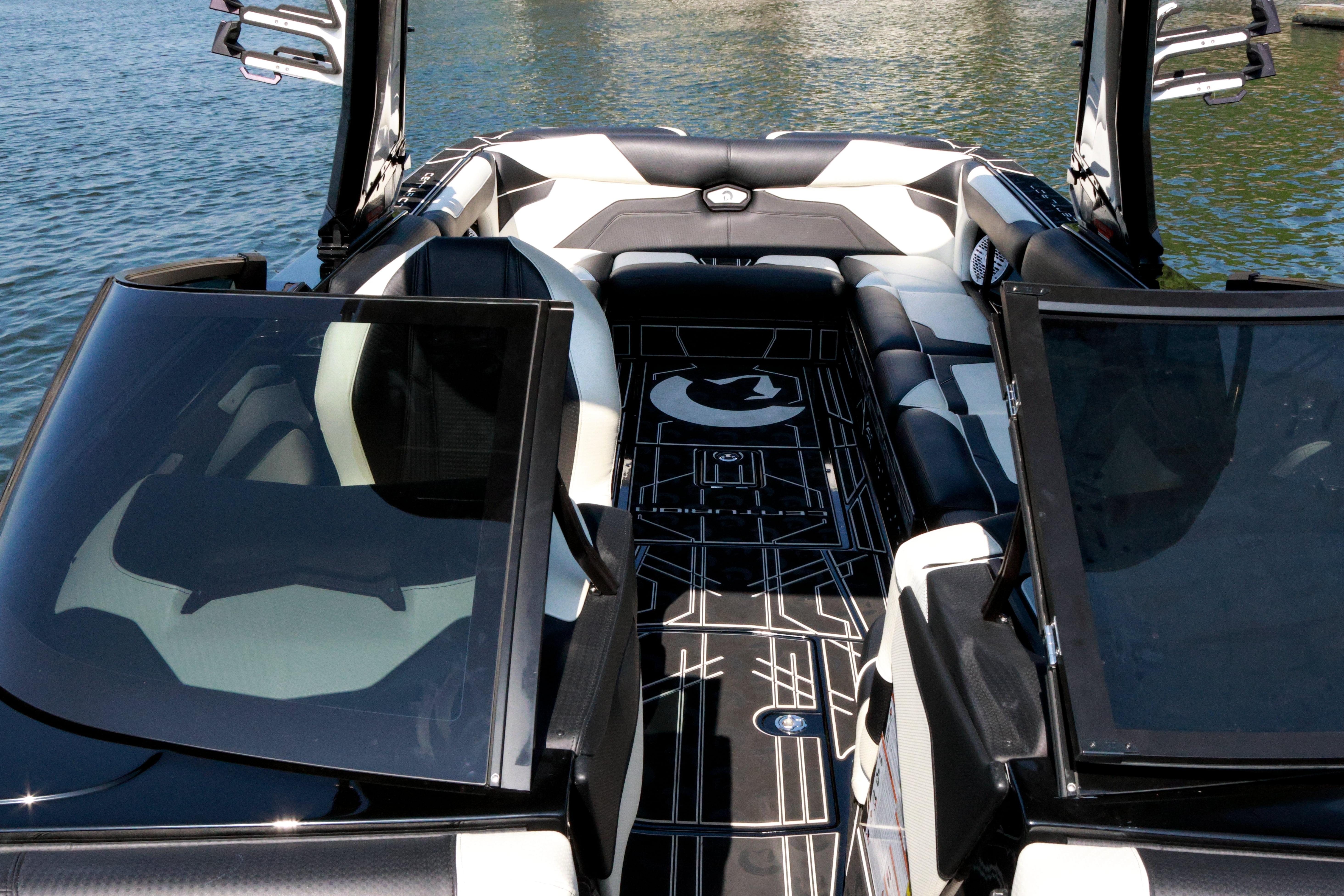 2022 Centurion Ri265 boat interior with sleek black and white seating on the water.