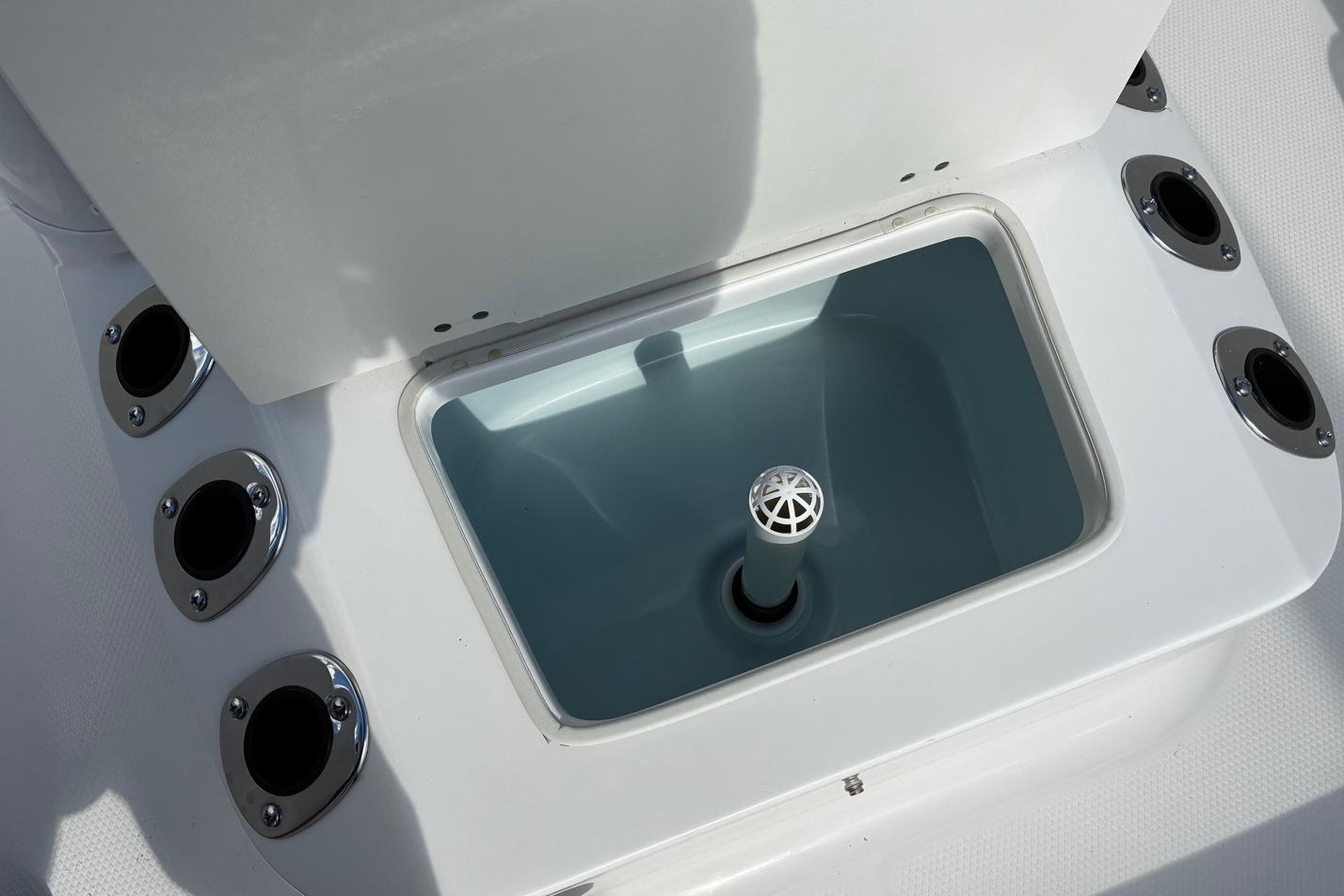 2026 Robalo R160 Center Console livewell with multiple rod holders.