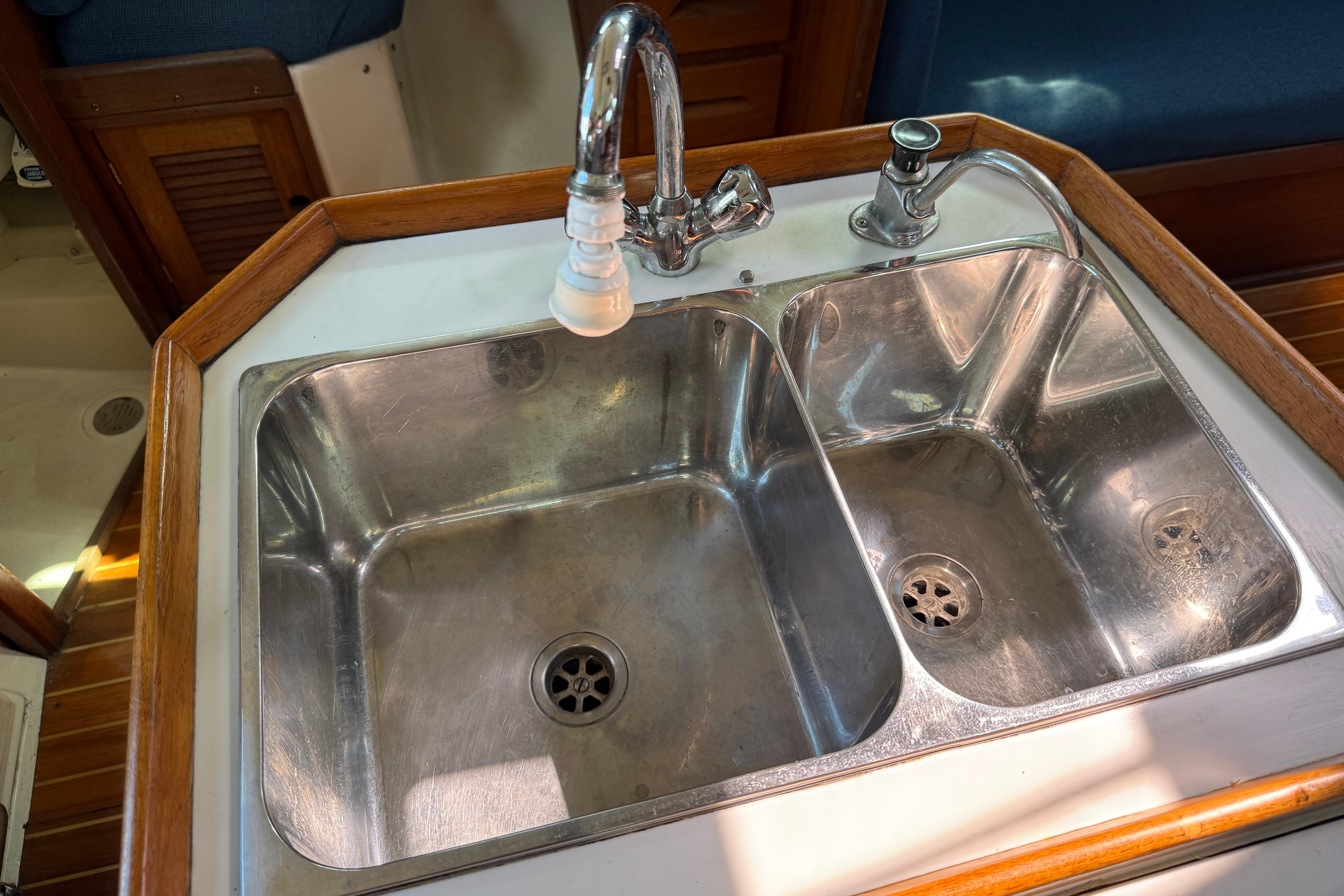 Stainless steel double sink in 1997 Tartan 3800 yacht galley.