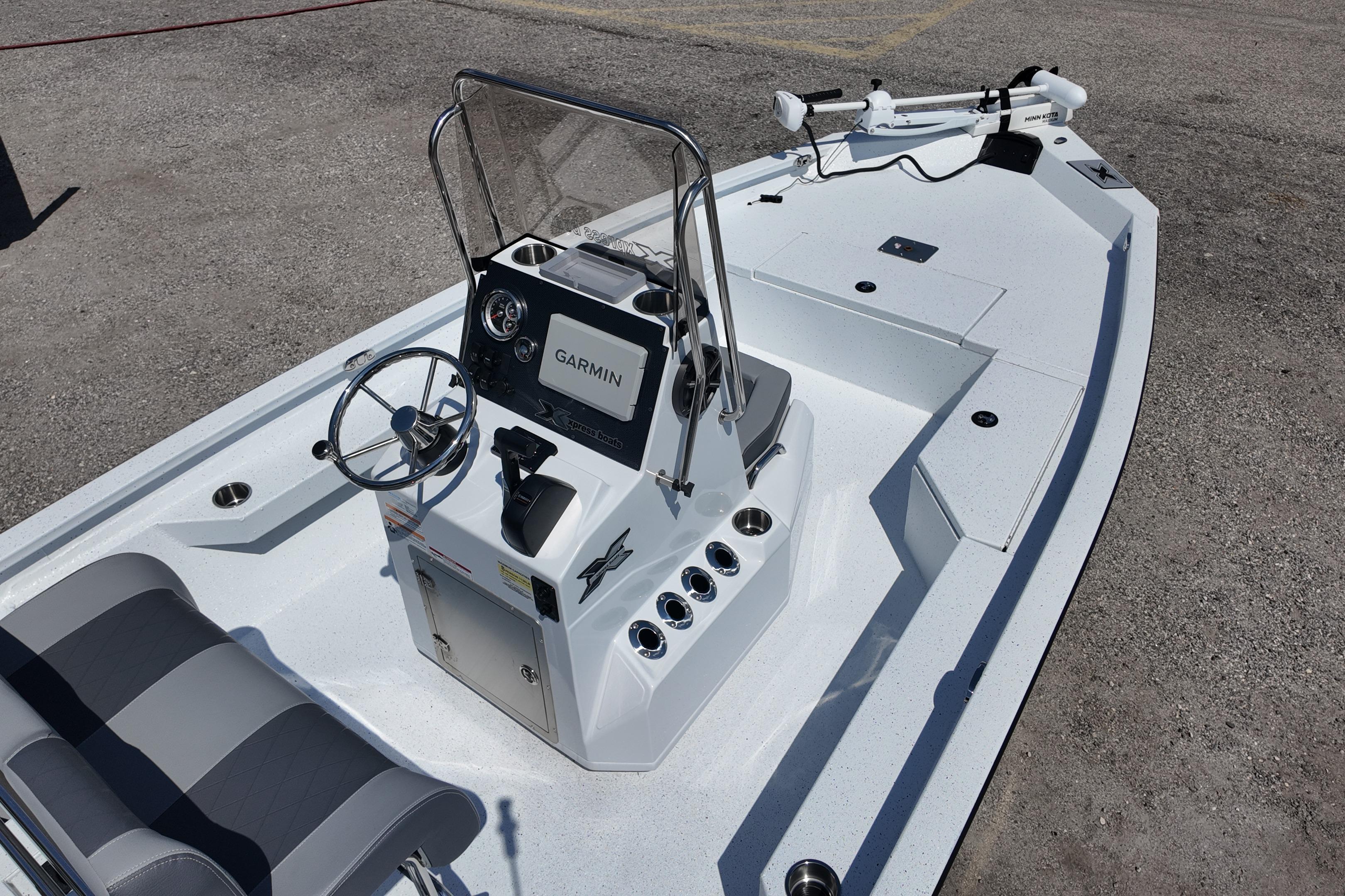 2026 Xpress H20 boat interior with Garmin navigation system and steering console.