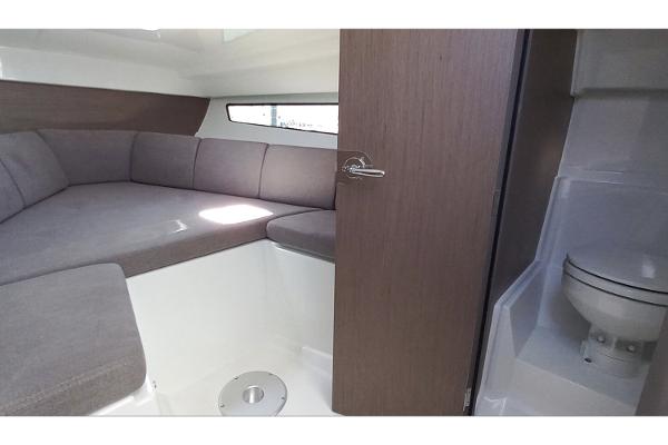 Manufacturer Provided Image: Interior of 2026 Beneteau Flyer 8 SUNdeck with seating and compact bathroom.