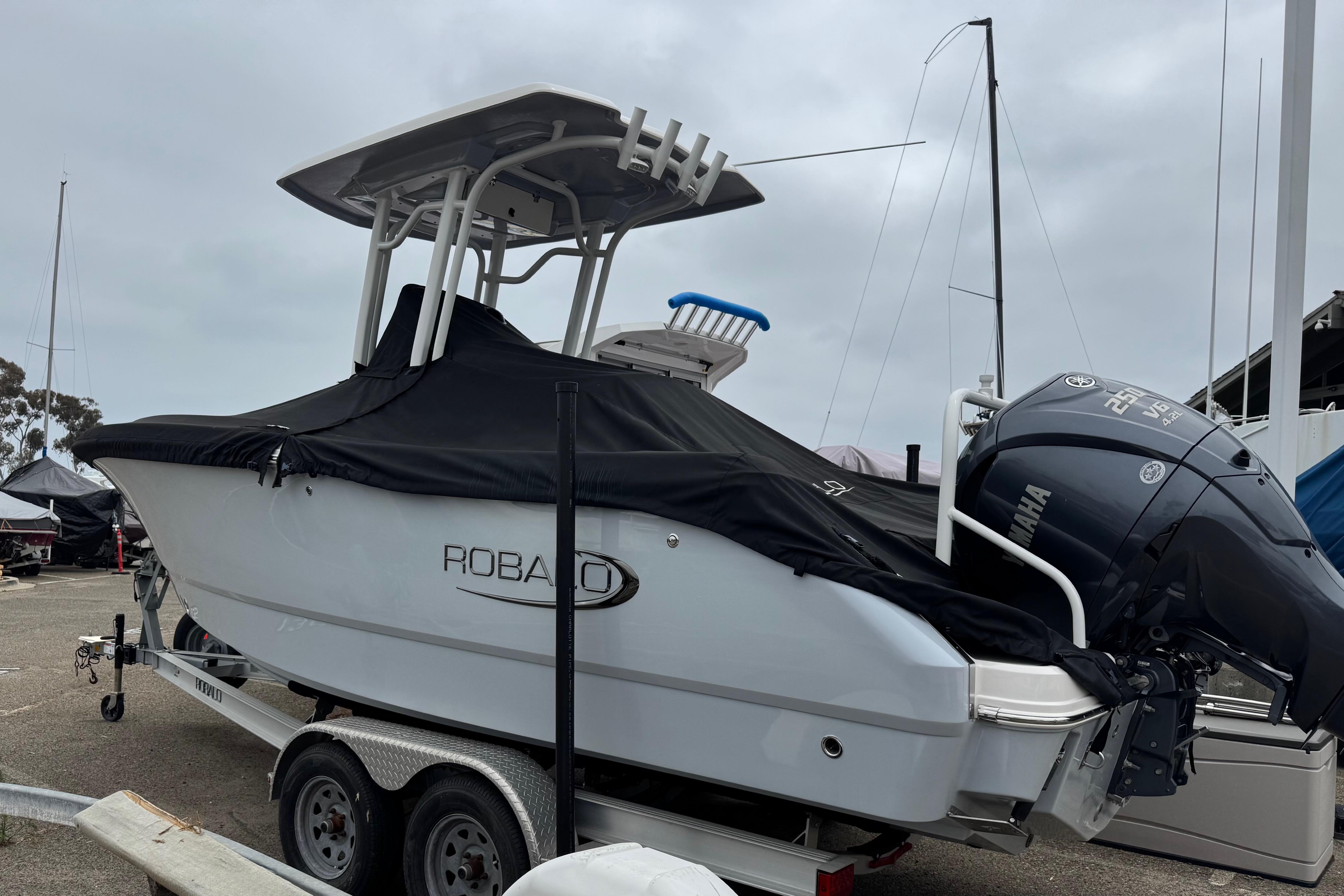 2022 Robalo R230 Center Console boat with Yamaha engine on trailer.