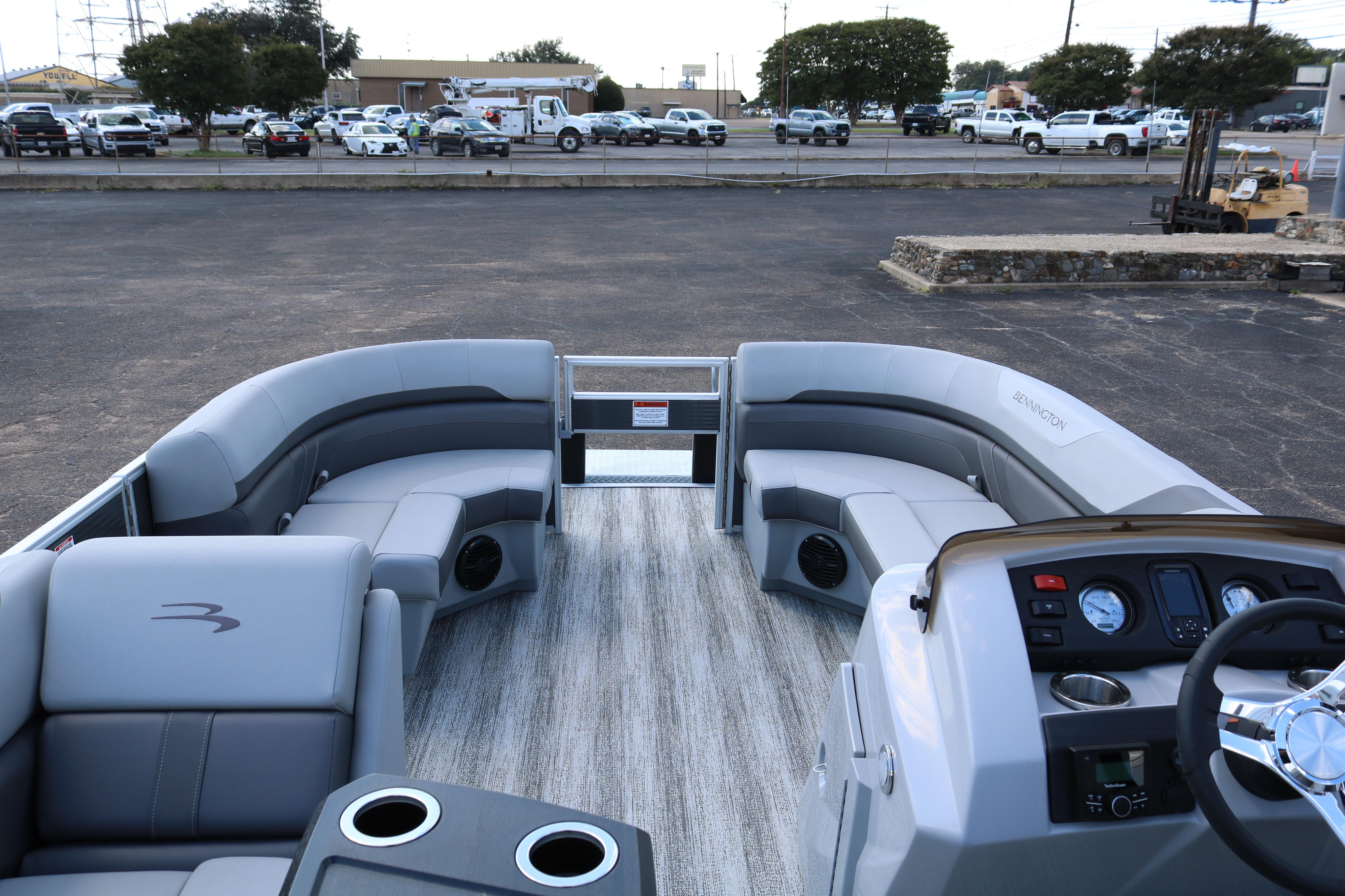 2026 Bennington 20SXSNP REAR FISH pontoon boat interior with plush seating and modern dashboard.
