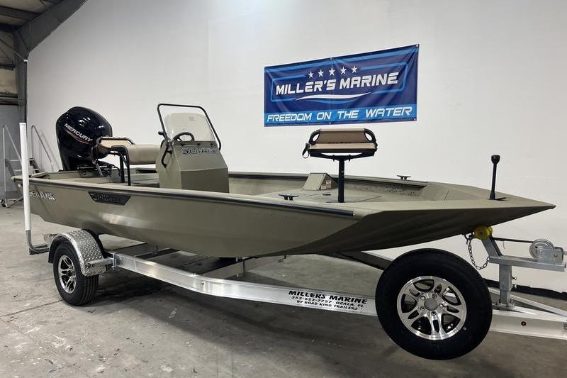 2025 SeaArk Shadow 18T boat on trailer at Miller's Marine showroom.