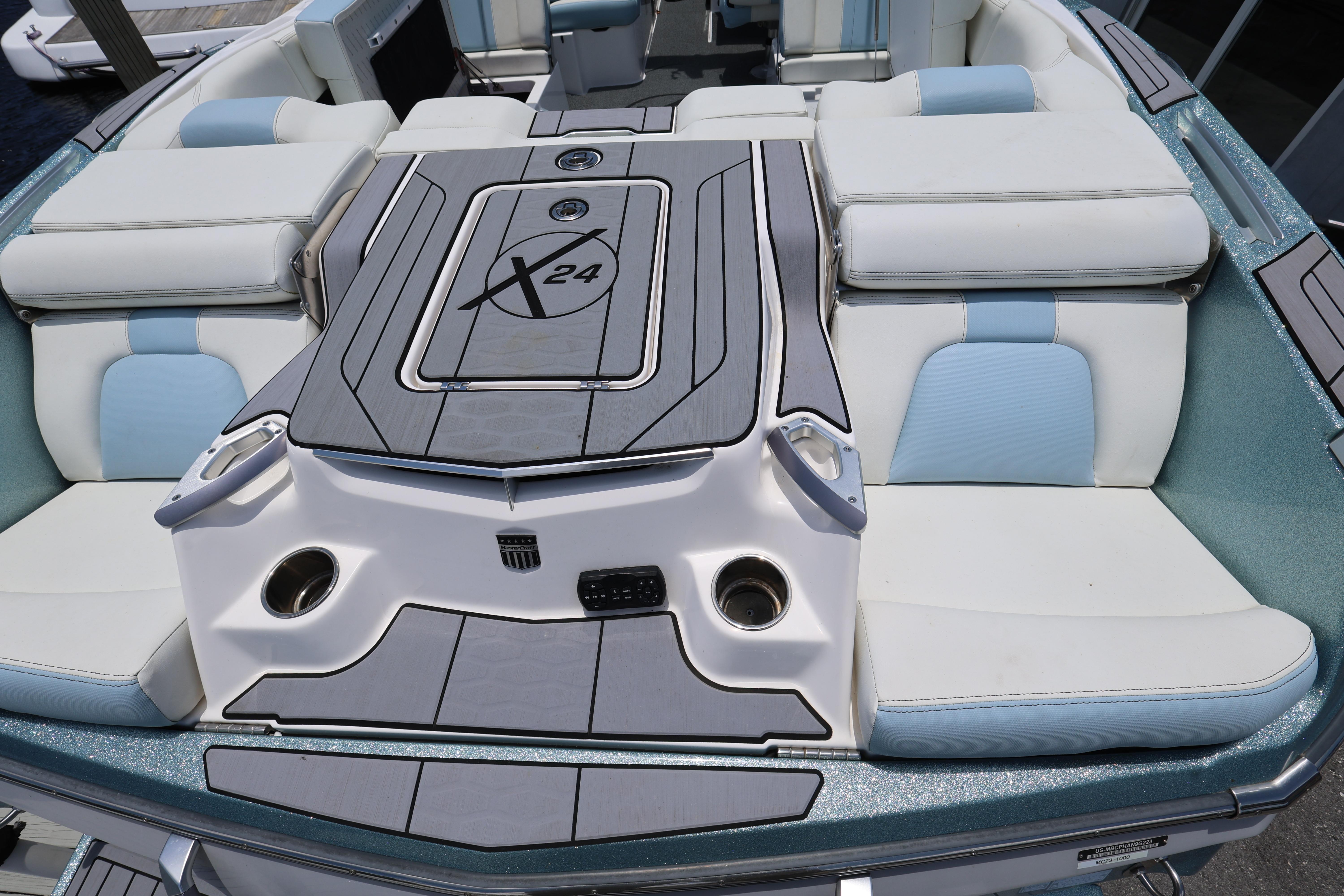 2023 MasterCraft X24 boat interior with luxurious seating and sleek design.