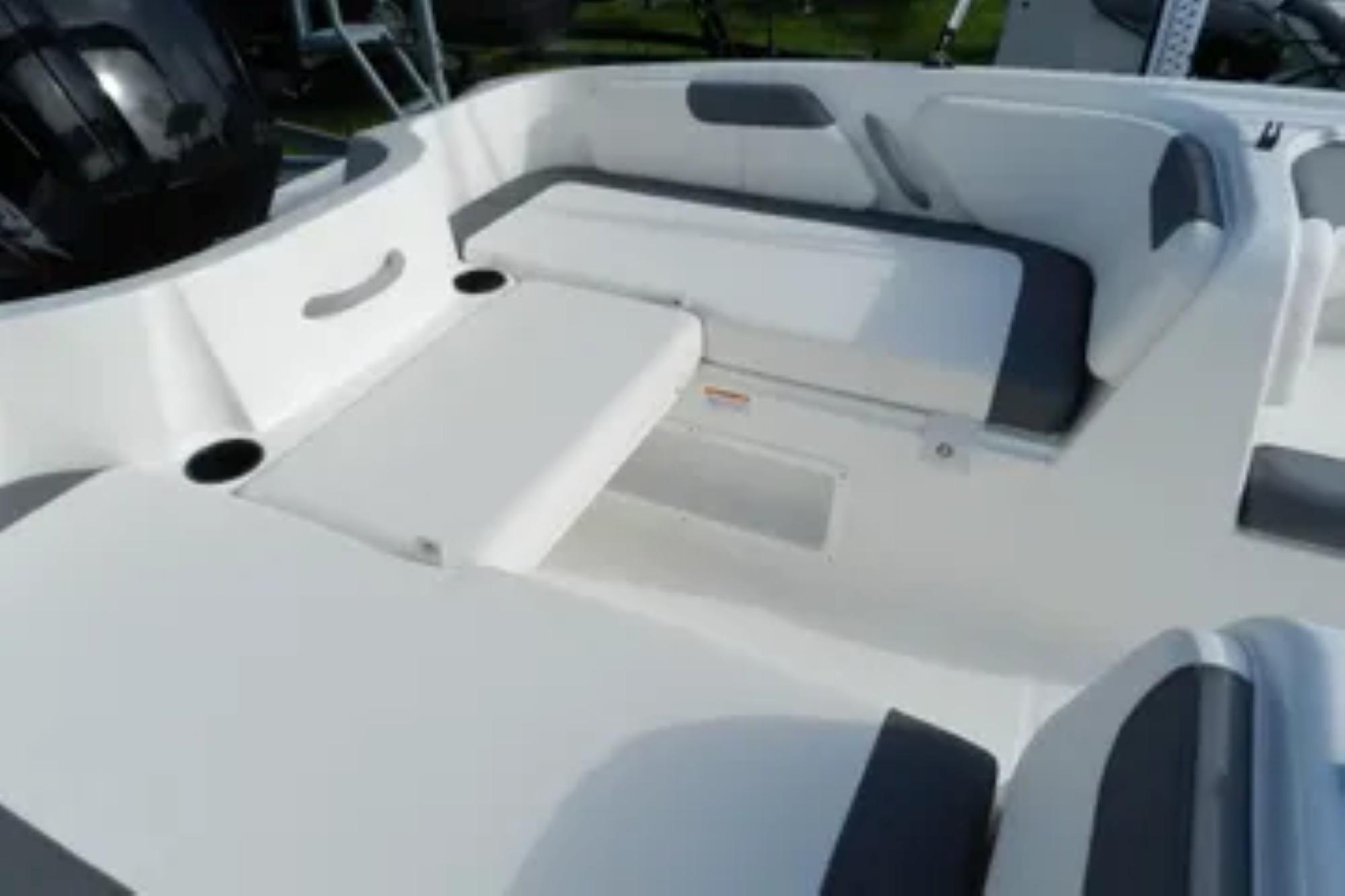 2026 Bayliner Element E18 boat interior with white and gray seating.