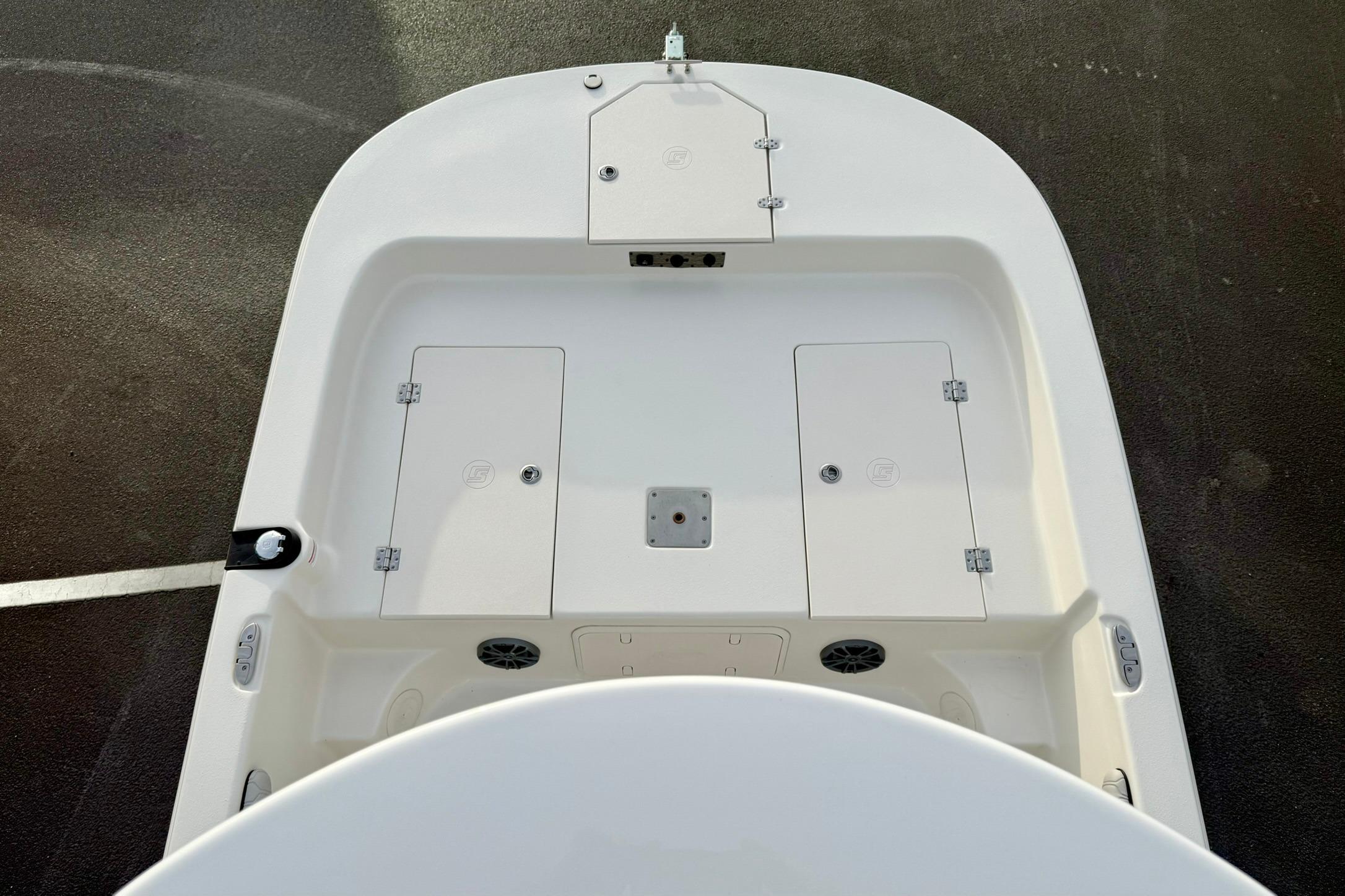 2025 Carolina Skiff 21 LS boat deck with storage compartments and speakers.