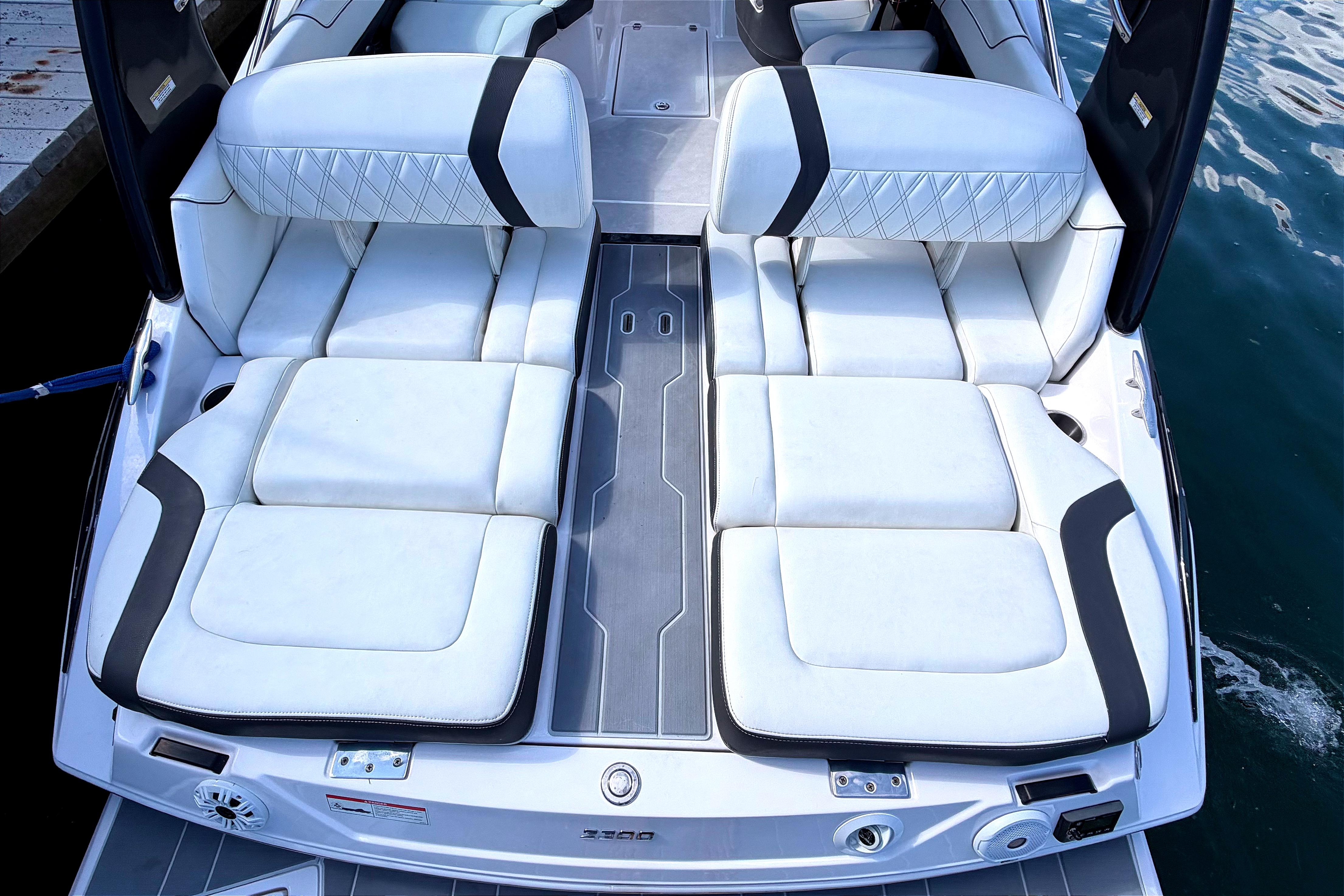 2020 Regal 2300 Bowrider boat with luxurious white seating and sleek design.