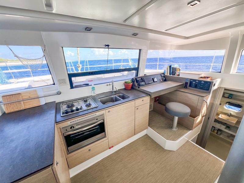 Modern kitchen and navigation area inside a 2016 Bali 4.0 catamaran yacht.