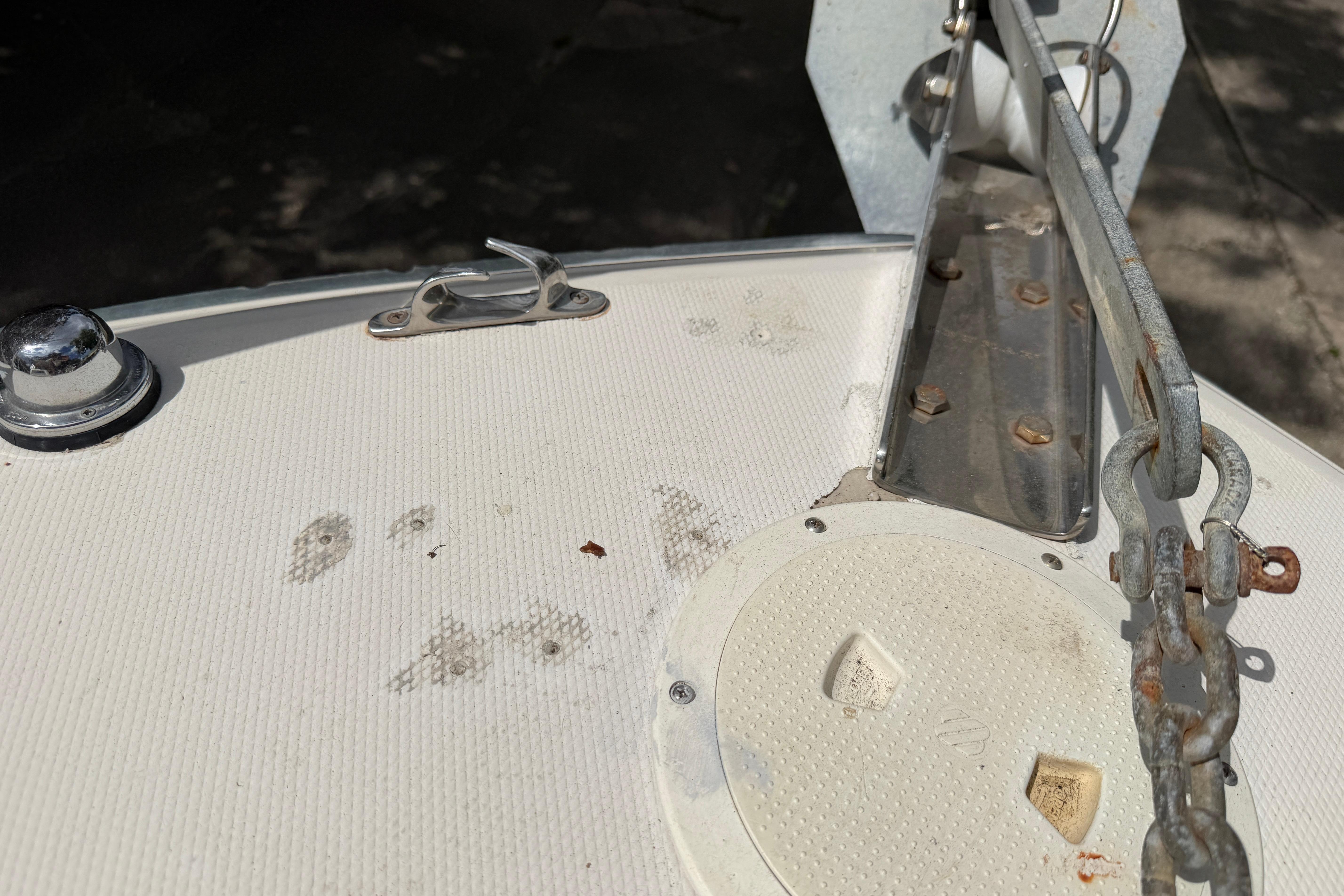 1987 Grady-White Seafarer 226 boat deck with anchor chain and cleat.
