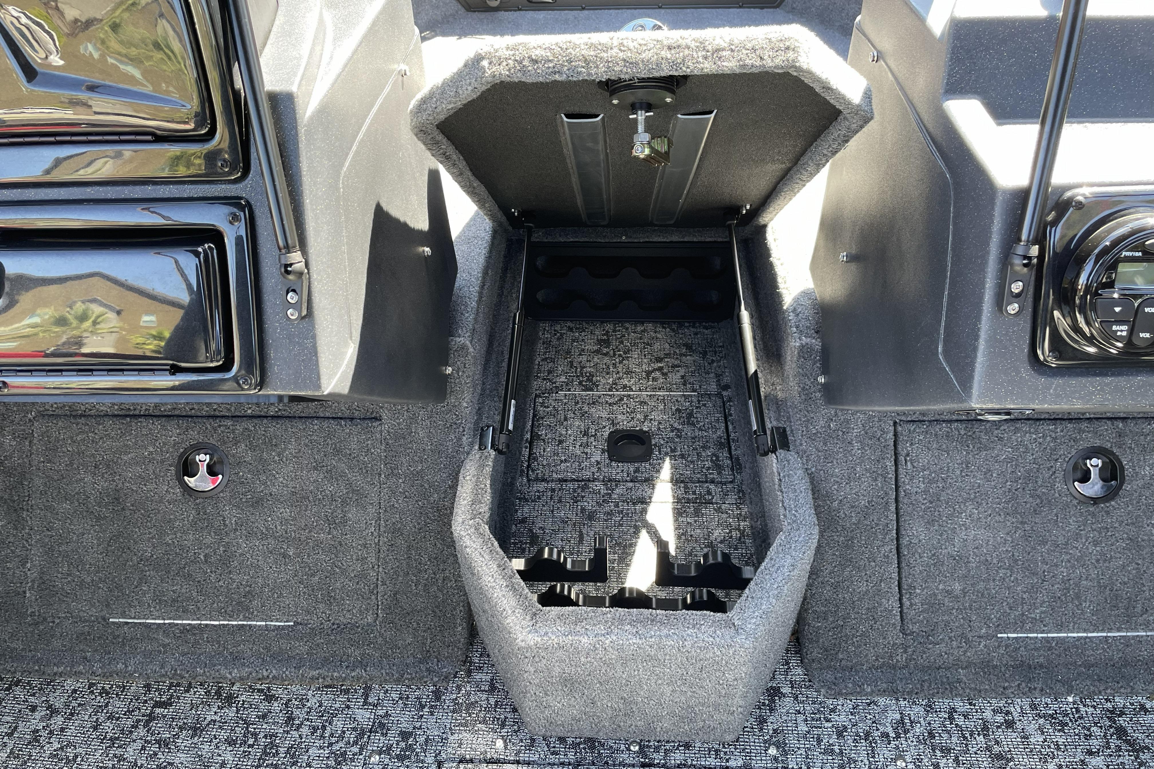2026 Tracker Targa V-18 WT boat interior storage compartment, open and empty.