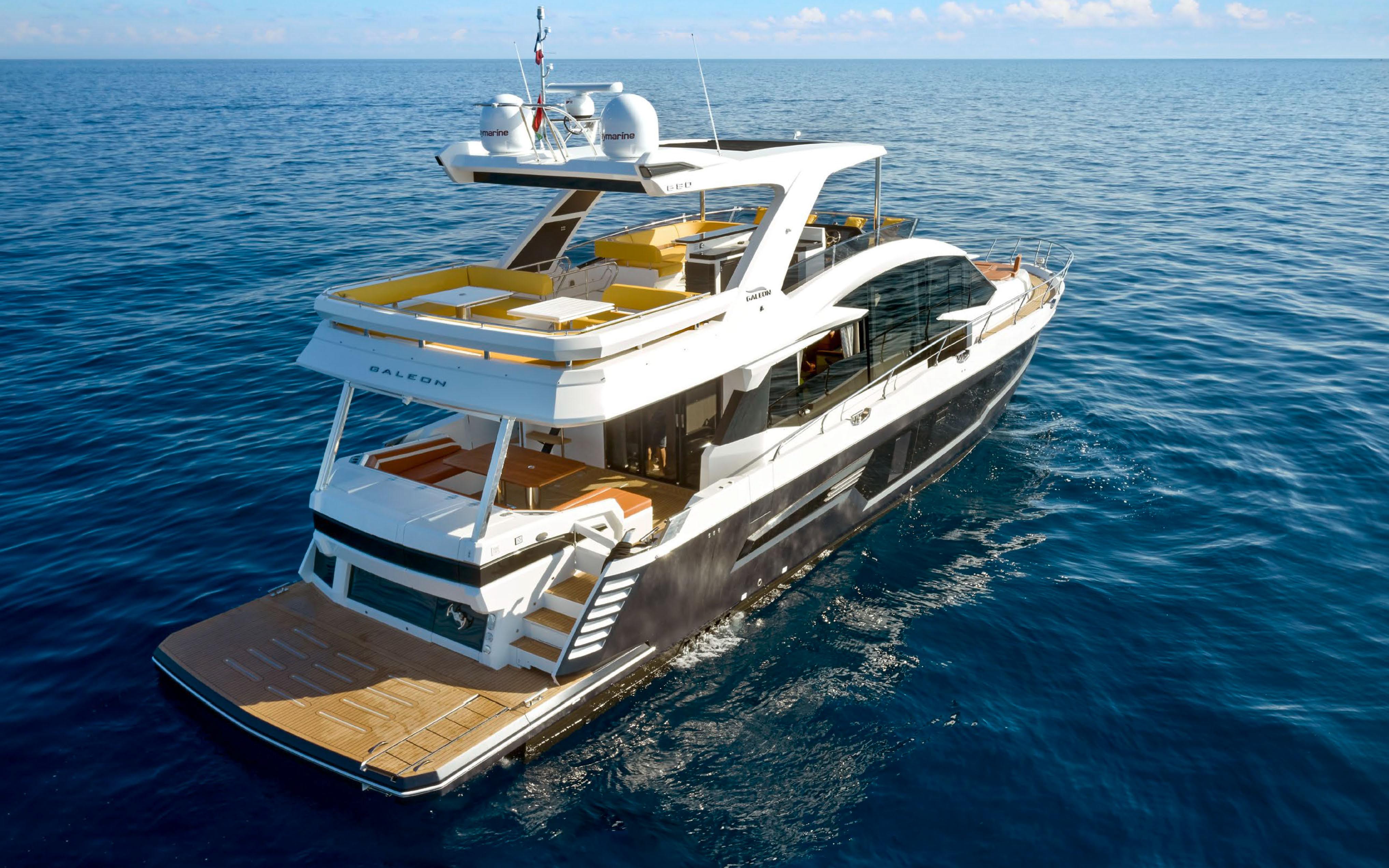 2023 Galeon 680 Fly luxury yacht cruising on open water.
