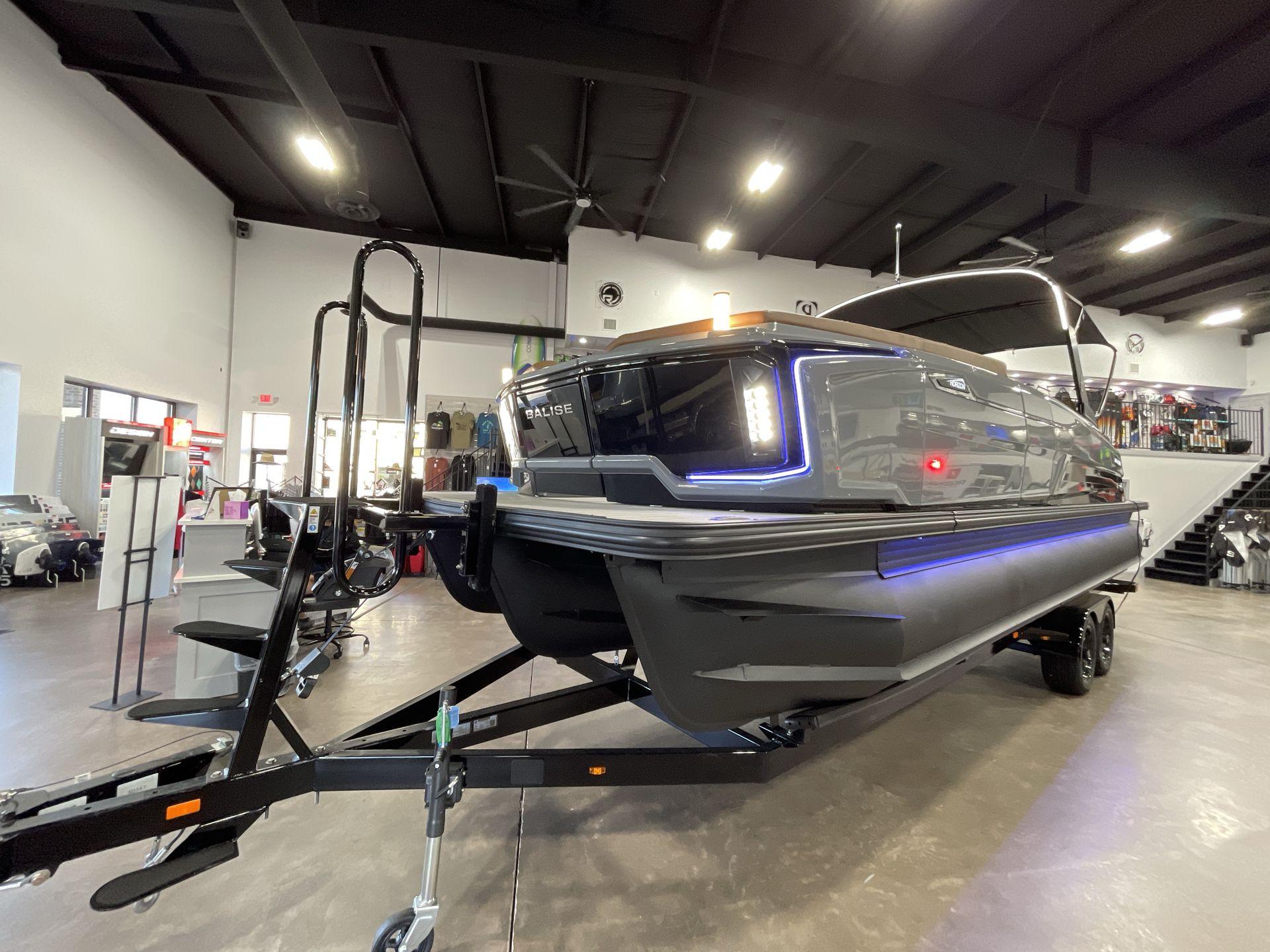 2025 Balise Horizon 26C boat displayed indoors on a trailer.