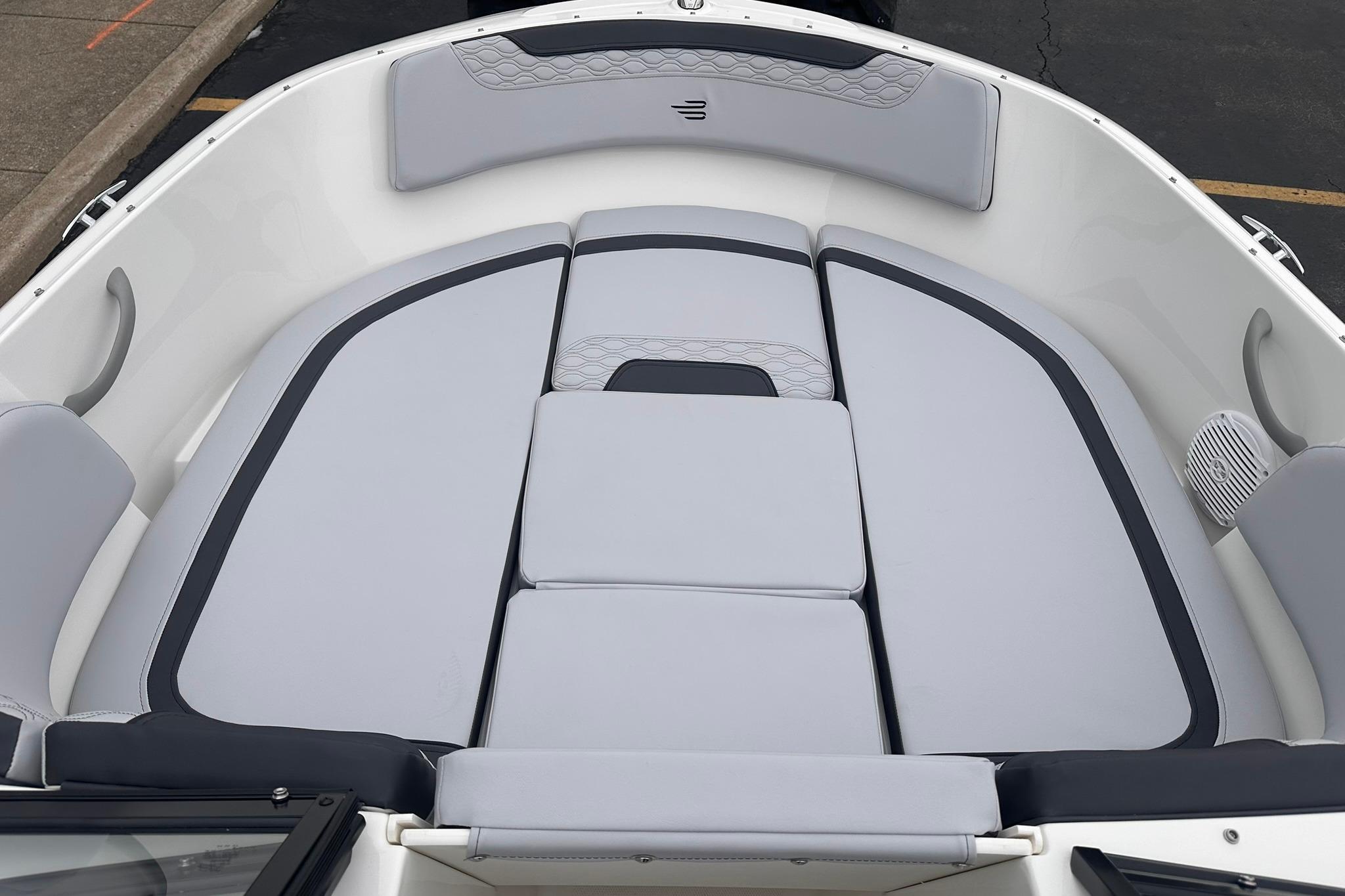 2026 Bayliner M17 boat interior with cushioned seating and modern design.