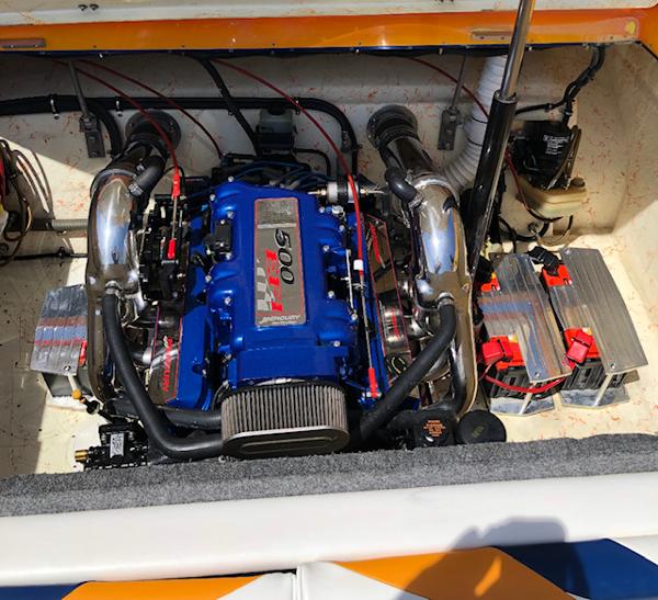 2001 Eliminator Eagle boat engine compartment with a powerful blue engine.