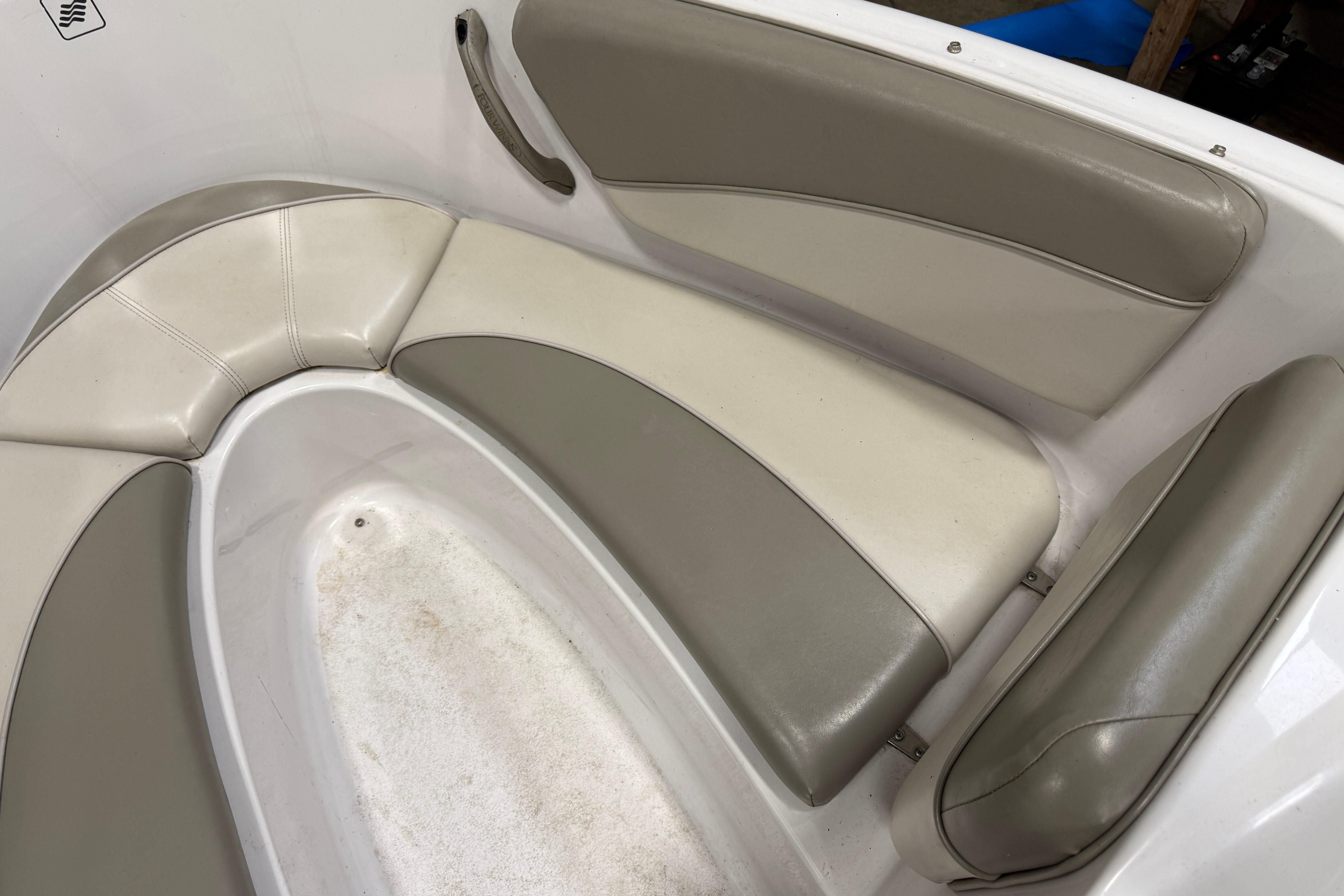 1999 Four Winns 170 Horizon LE boat interior with beige and gray seating.