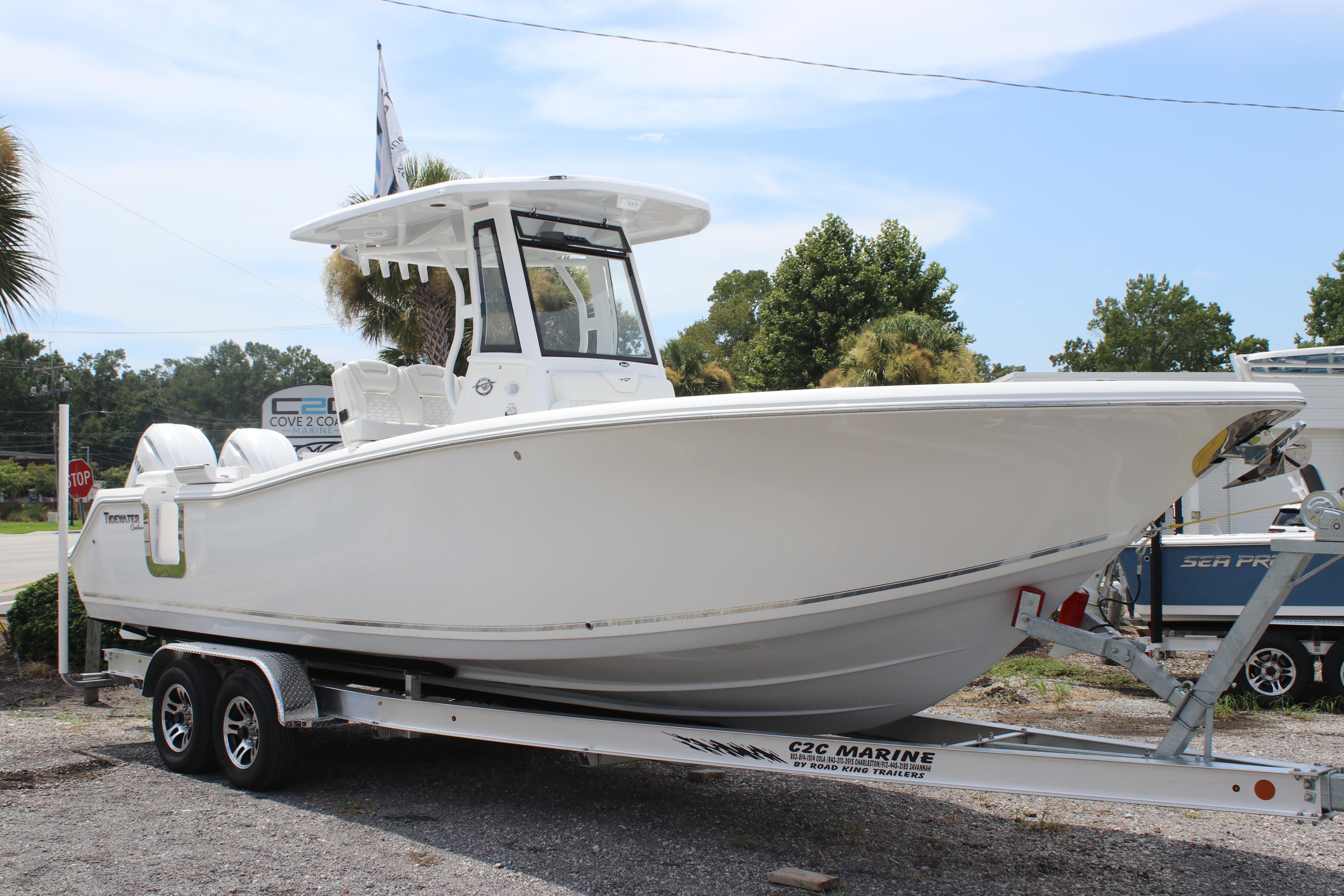 2026 Tidewater 272 LXF boat on trailer, parked outdoors under clear sky.