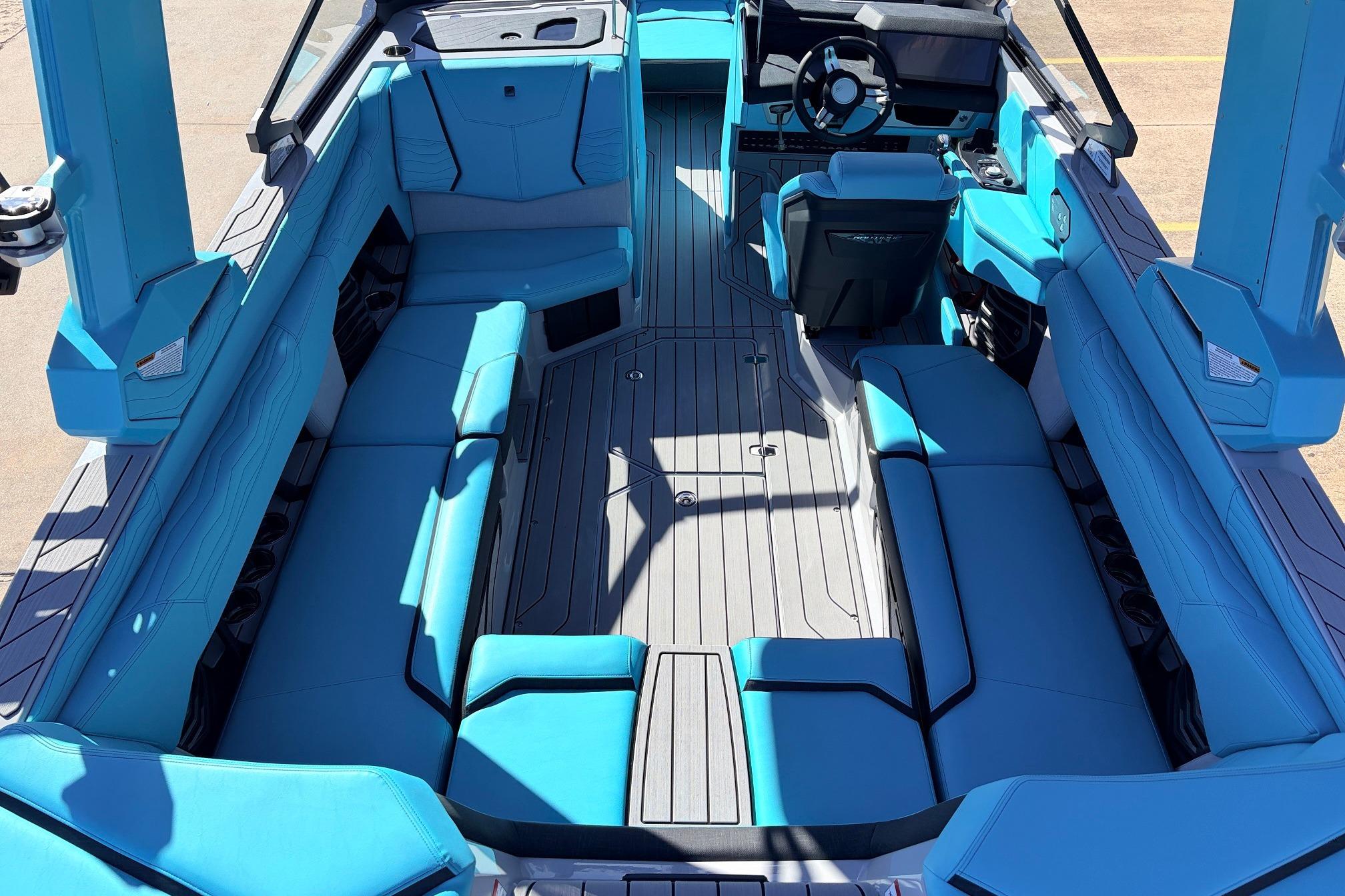2026 Nautique Super Air Nautique G23 interior with blue seating and modern design.