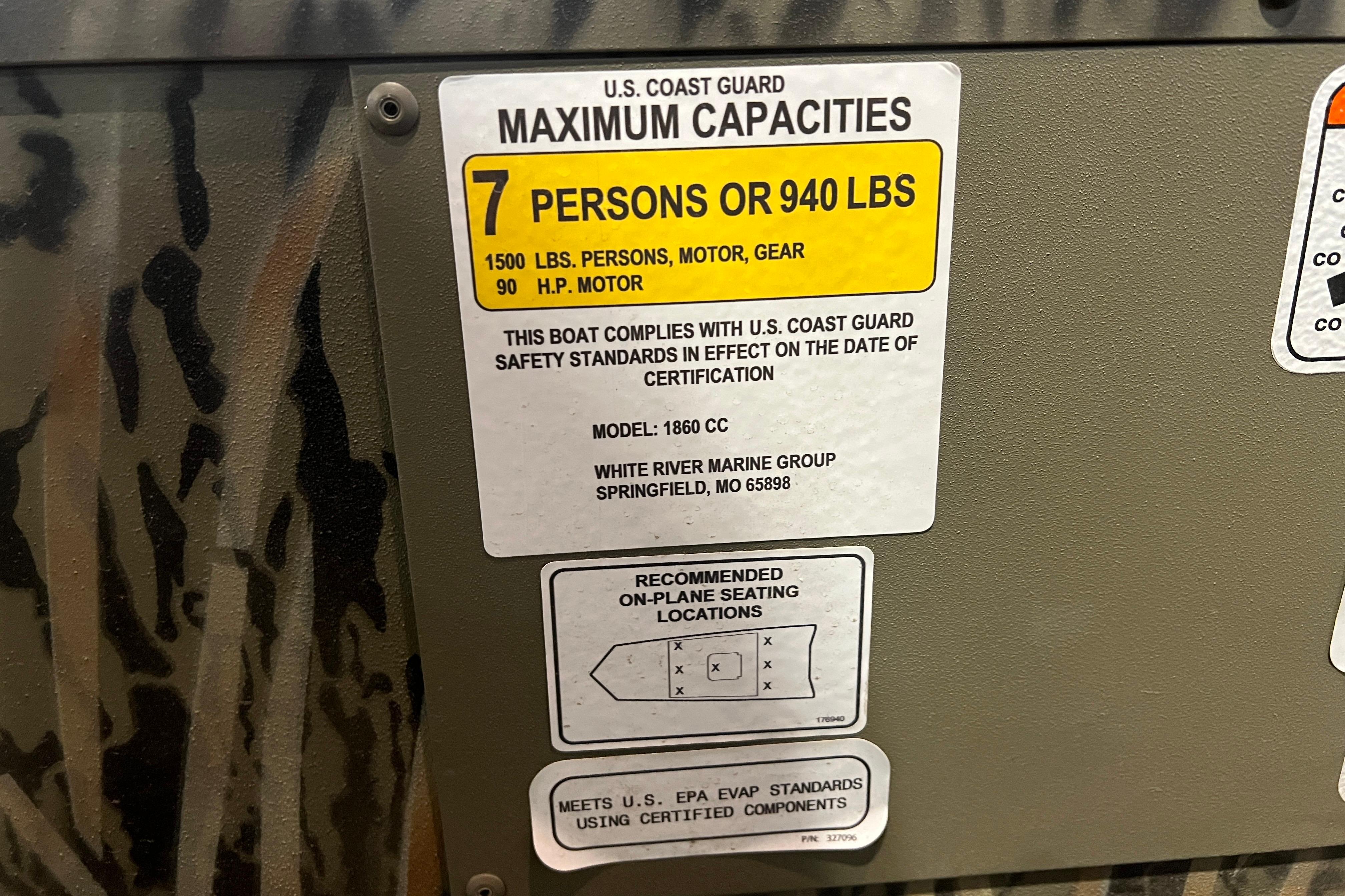 U.S. Coast Guard capacity label on 2026 Tracker Grizzly 1860 CC boat, 7 persons or 940 lbs.